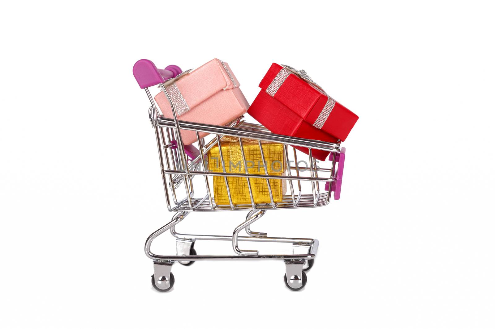 Side view of shopping card or trolley with colorful gift boxes isolated on white background.