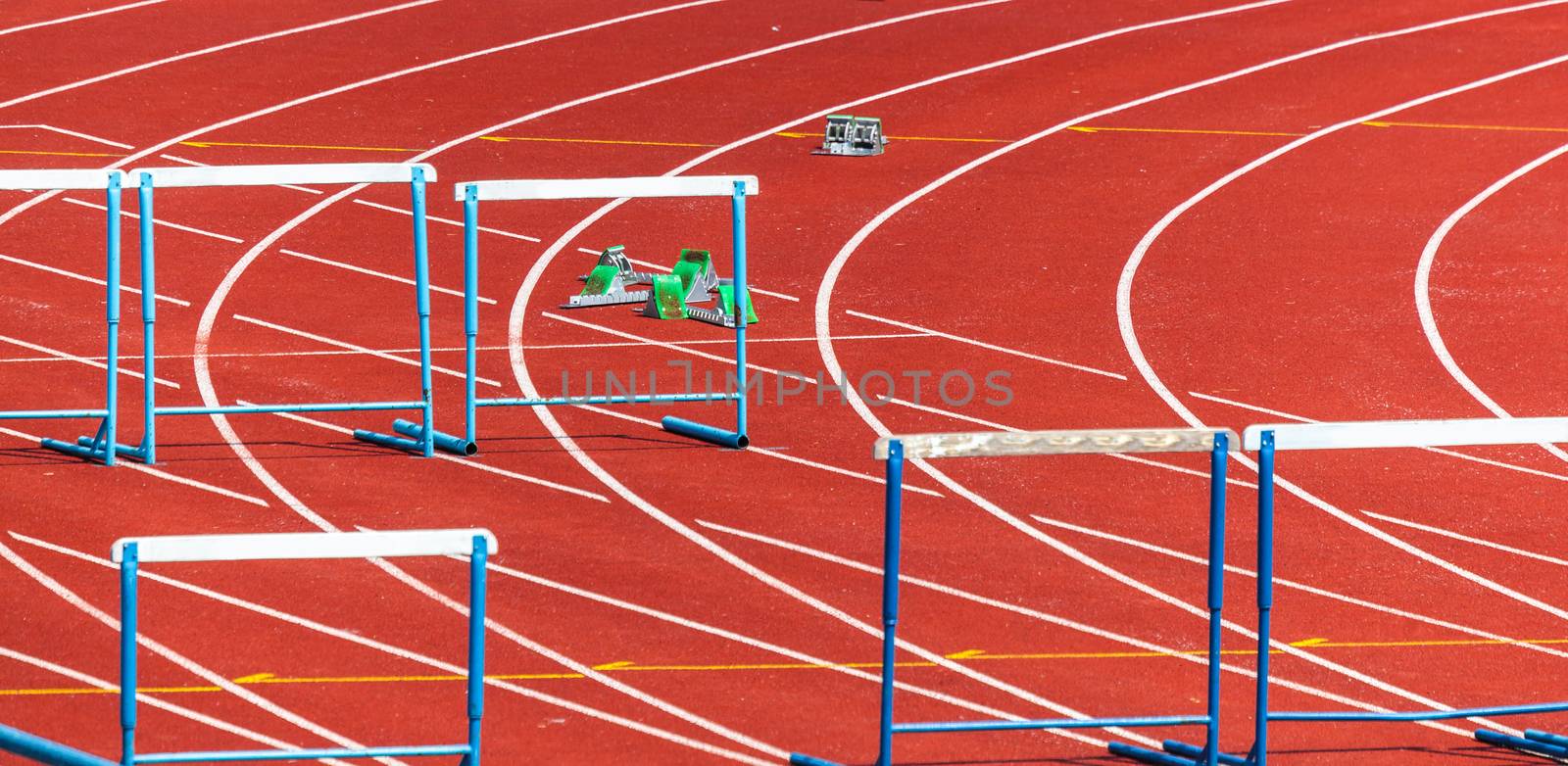 red treadmill with marking and the obstacles