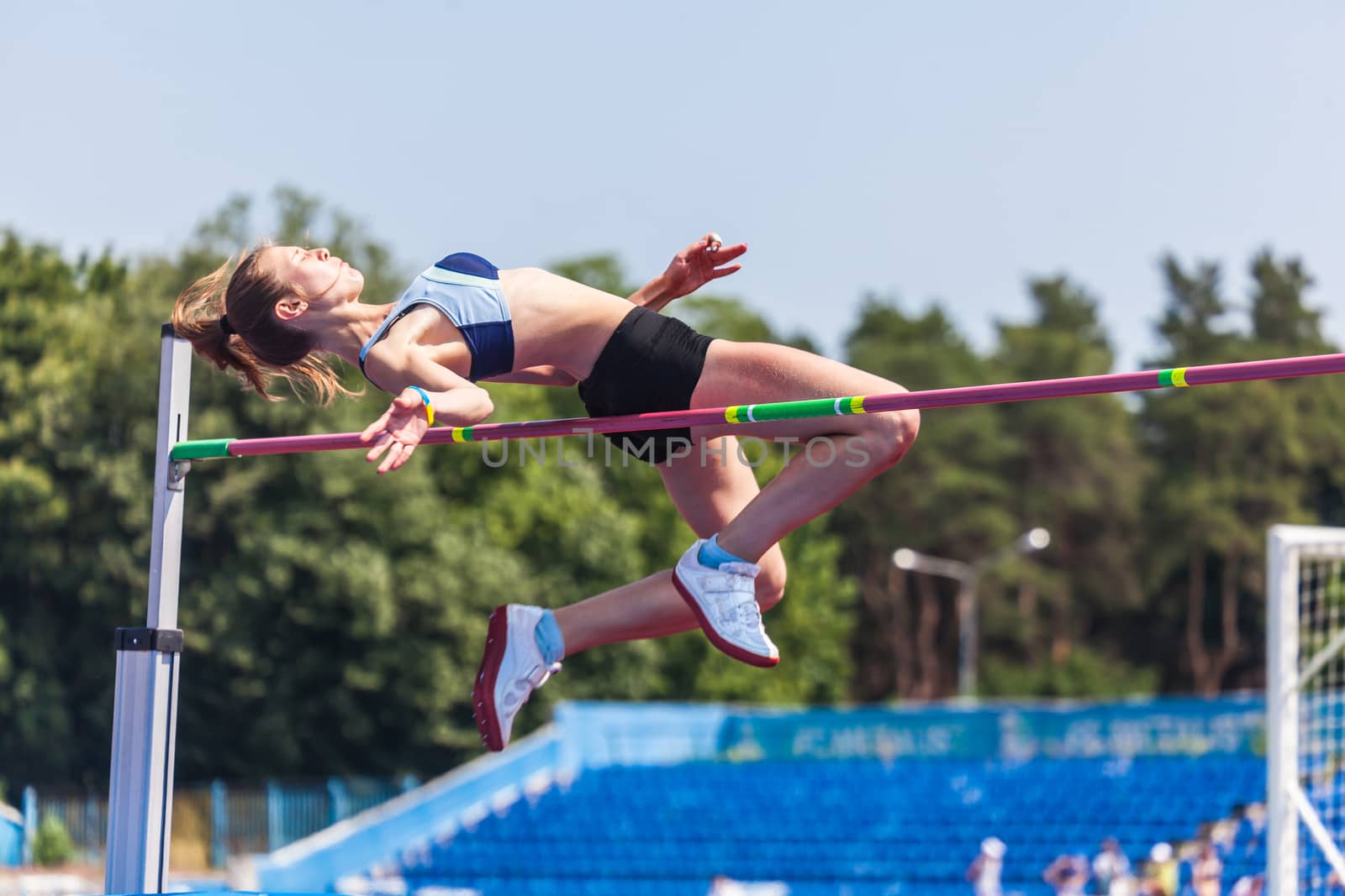 young woman in highjump,track and field