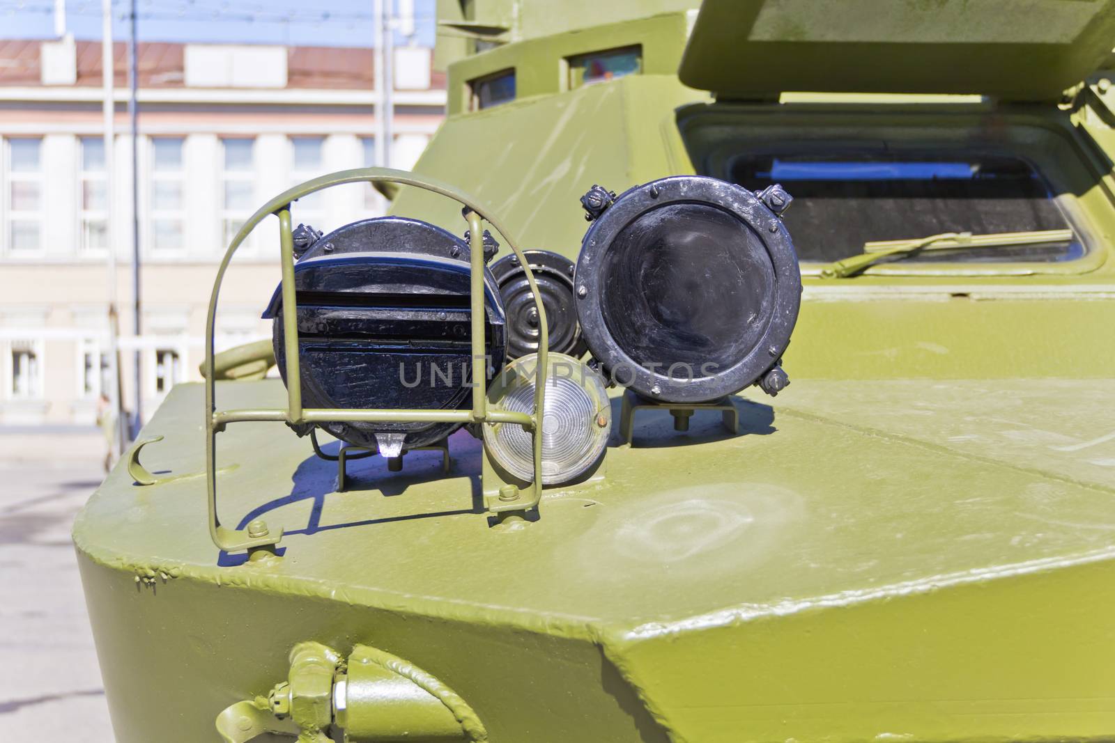 Headlight of military machine at the exhibition under open sky