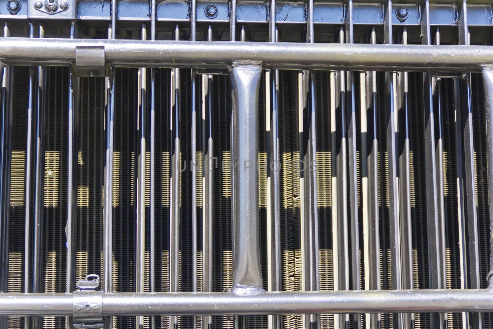 Radiator grille of military machine at the exhibition under open sky