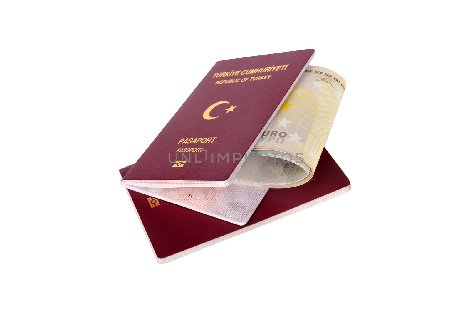 Finance concept, euro money banknotes in passport with the text Republic of Turkey in Turkish, isolated on white background.