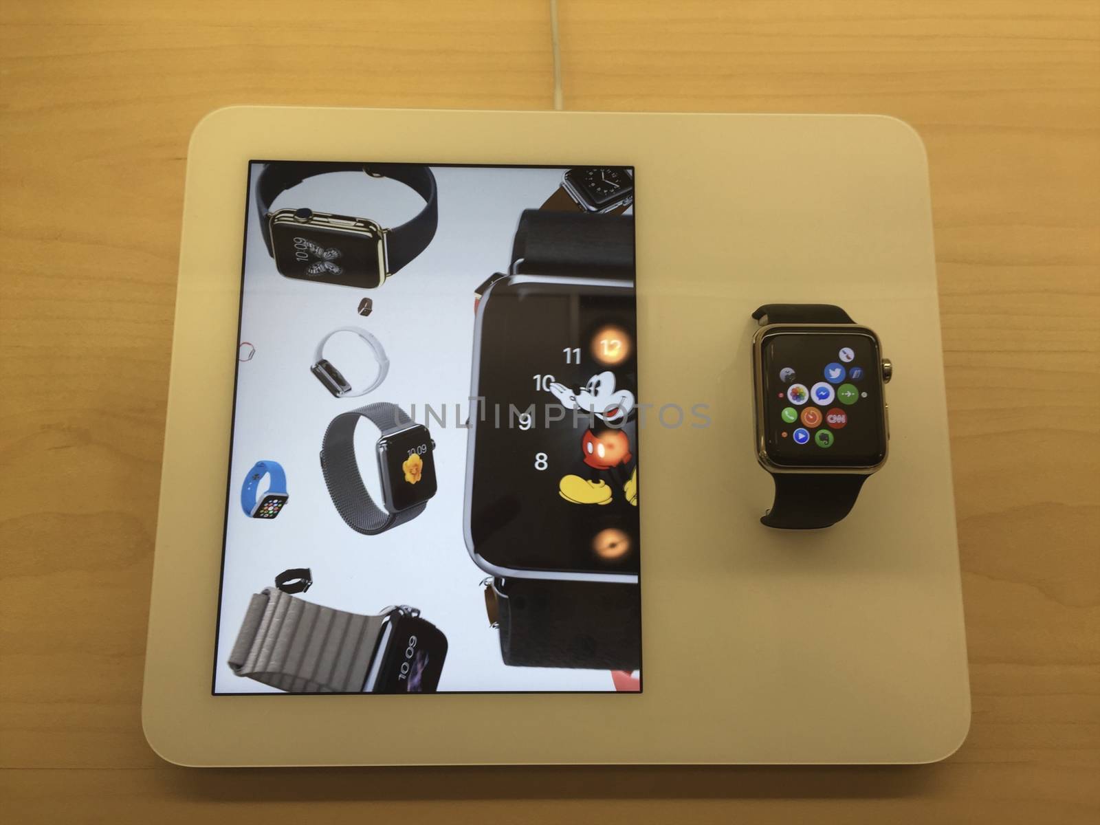 Apple sport watch displayed and video in store.

NEW YORK,  UNITED STATES AMERICA - APR 25 2015: New Apple Watch smartwatch displaying inside a glass cabinet, New York, USA