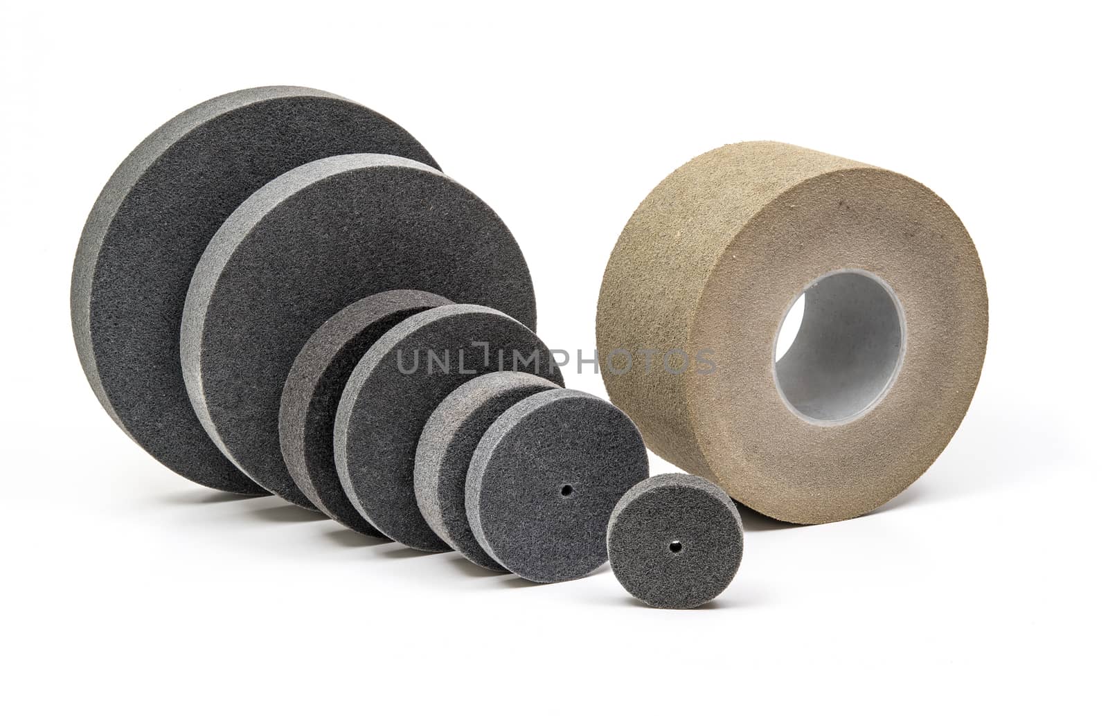 Professional Industrial grinding and polishing wheels on white background
