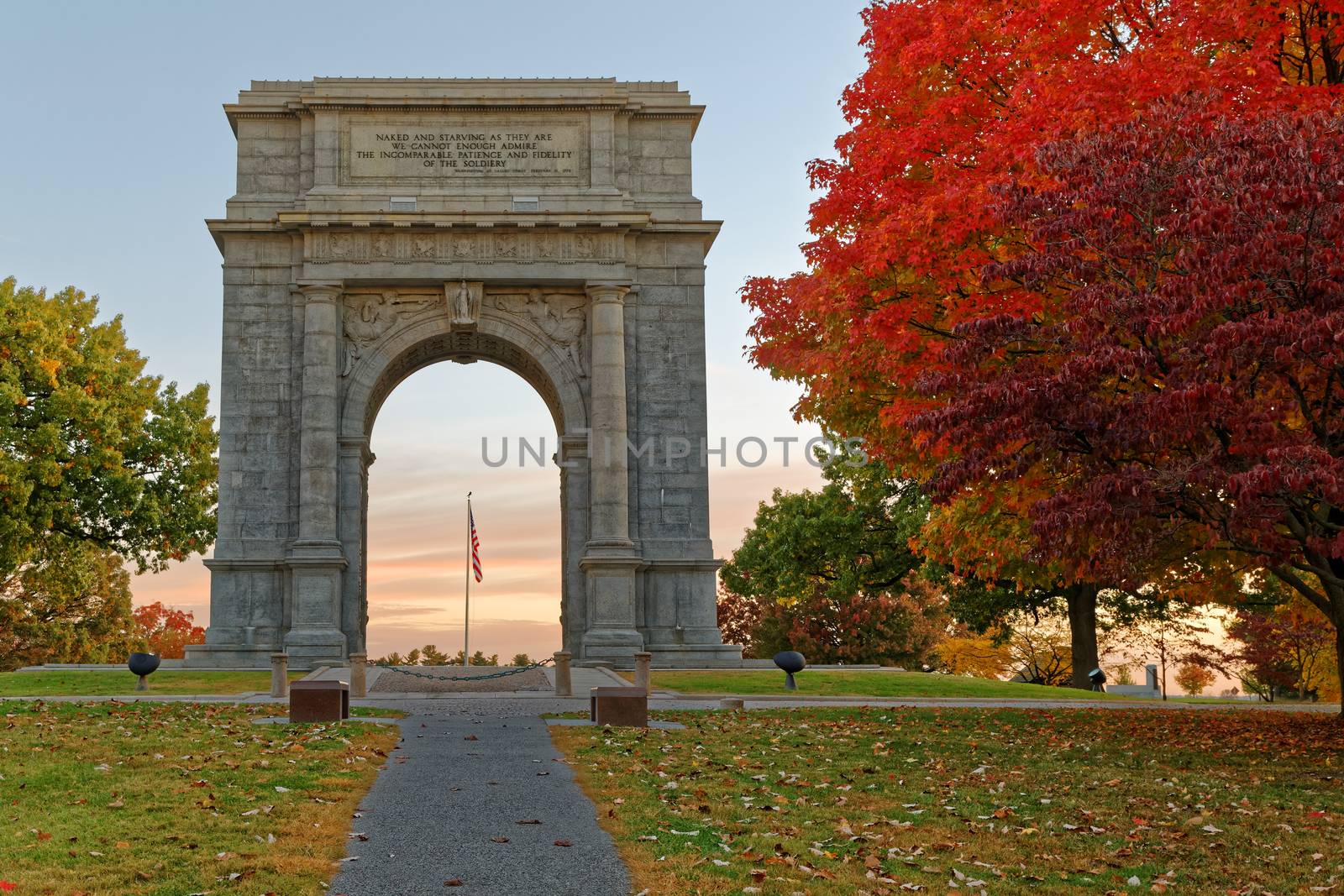 A beautiful autumn sunrise at Valley Forge. The National Memorial Arch is a  monument dedicated to George Washington and the United States Continental Army. This monument is located at Valley Forge National Historical Park in Pennsylvania, USA.