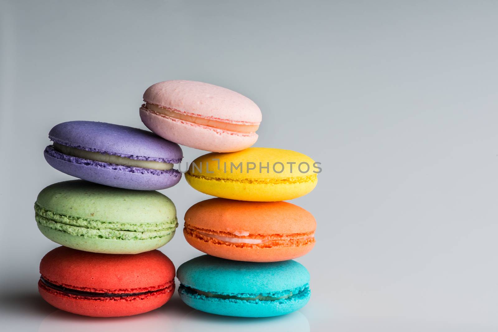 A variety of stacked colorful macaroons