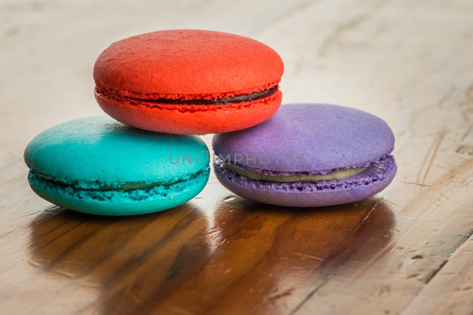 colorful macaroons on a vintage wooden table