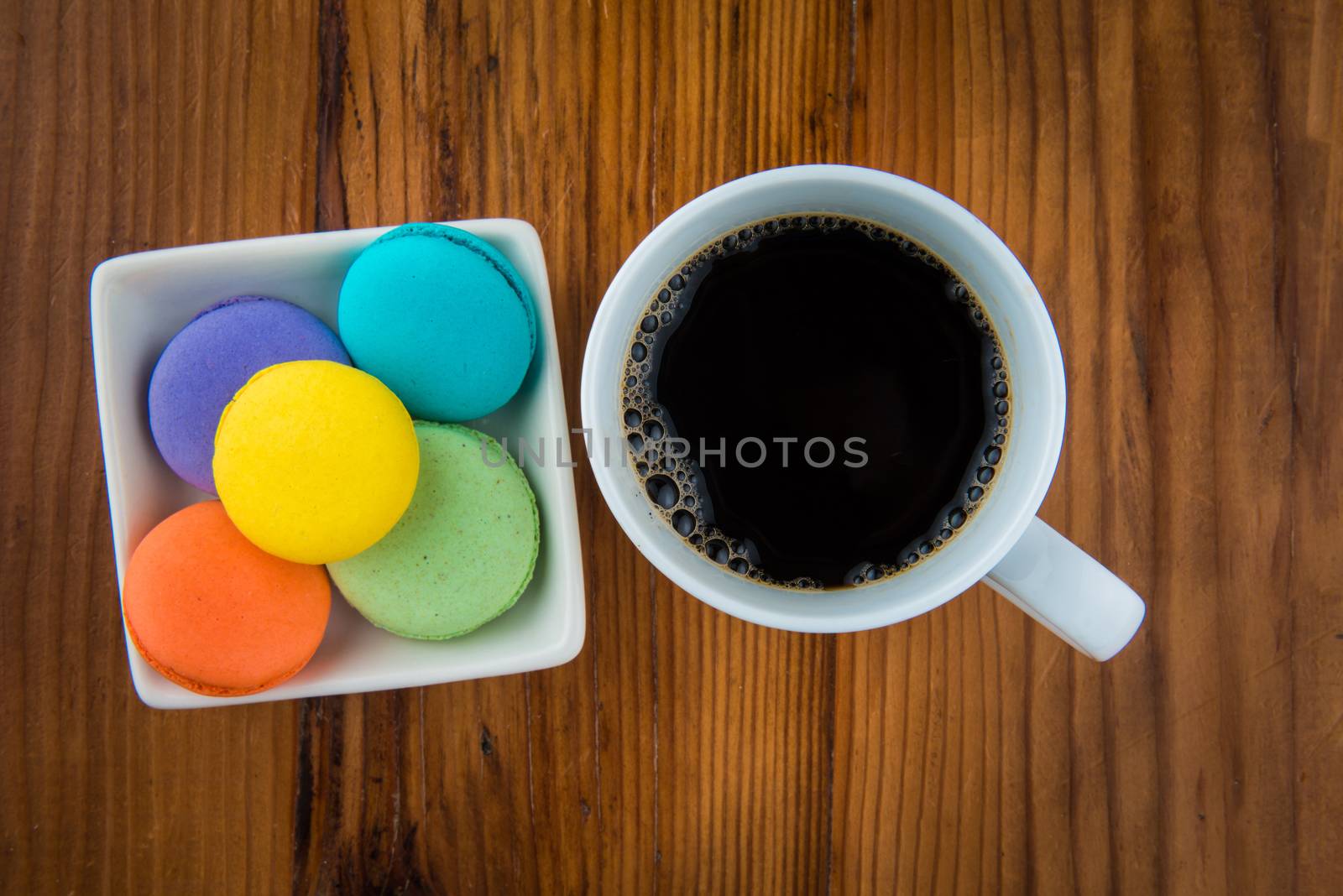 overhead view of macaroons and coffee