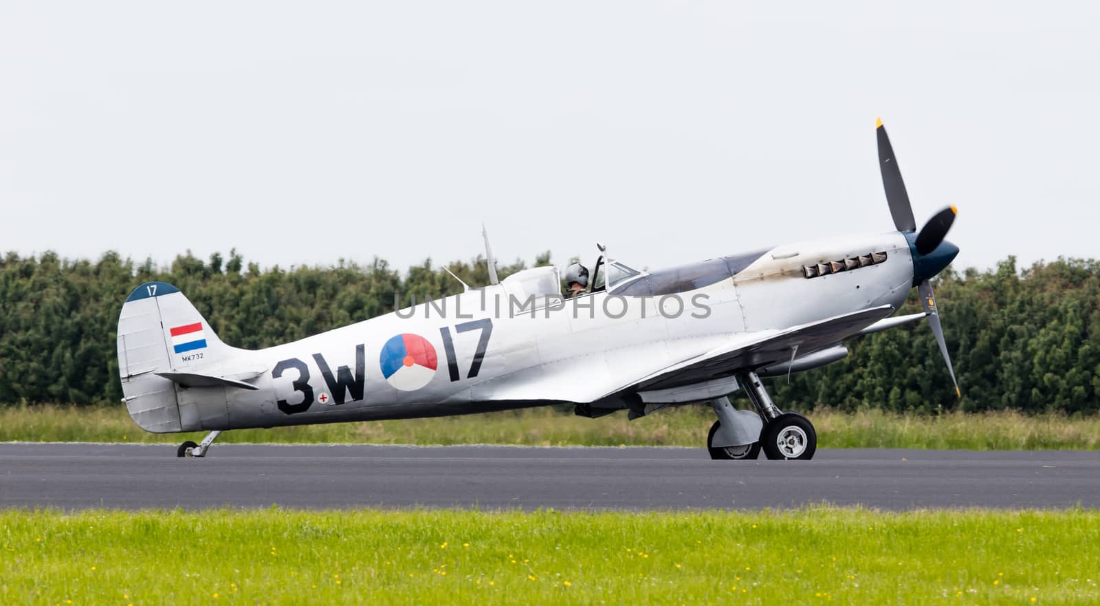 LEEUWARDEN, THE NETHERLANDS - JUNE 10, 2016: A vintage Spitfire fighter plane on the runway during a demonstration at the Royal Netherlands Air Force Days at Leeuwarden on June 10, 2016.