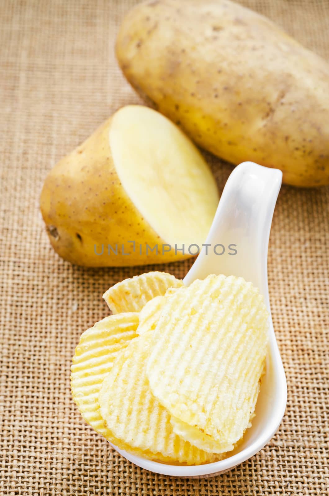 chips and peeled potatos by Gamjai