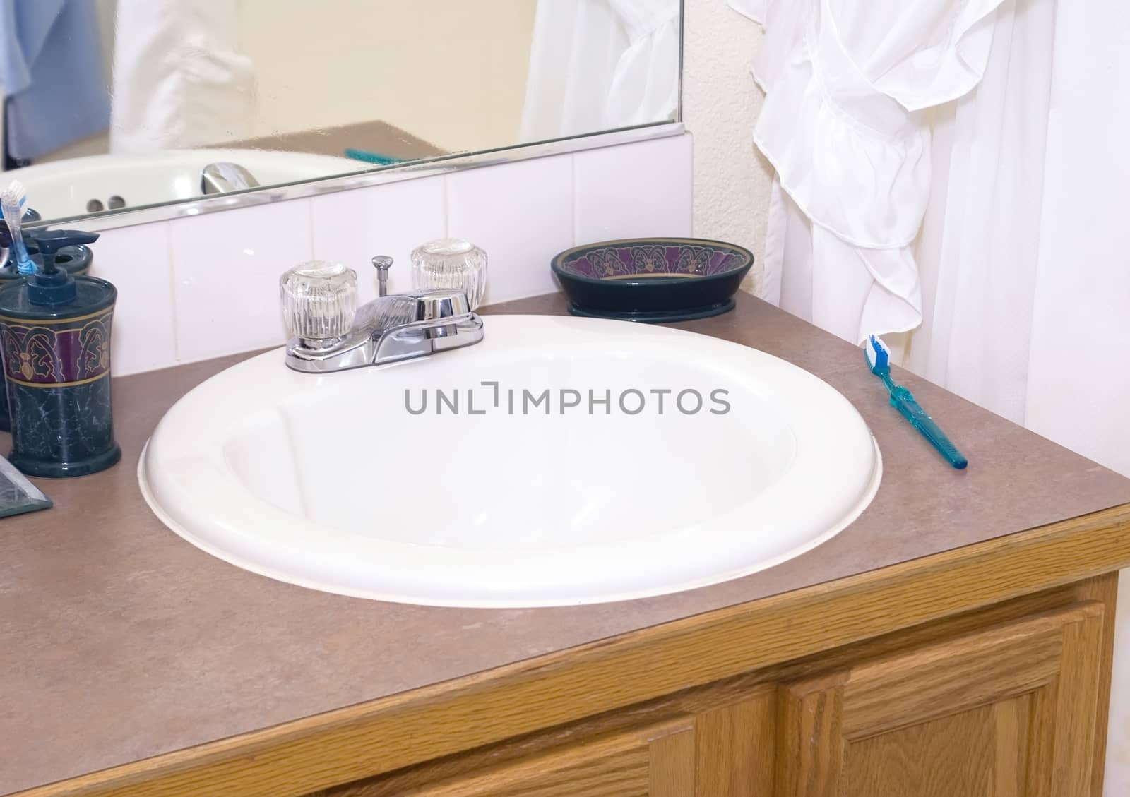 Bathroom sink and counter in a modern middle class home.