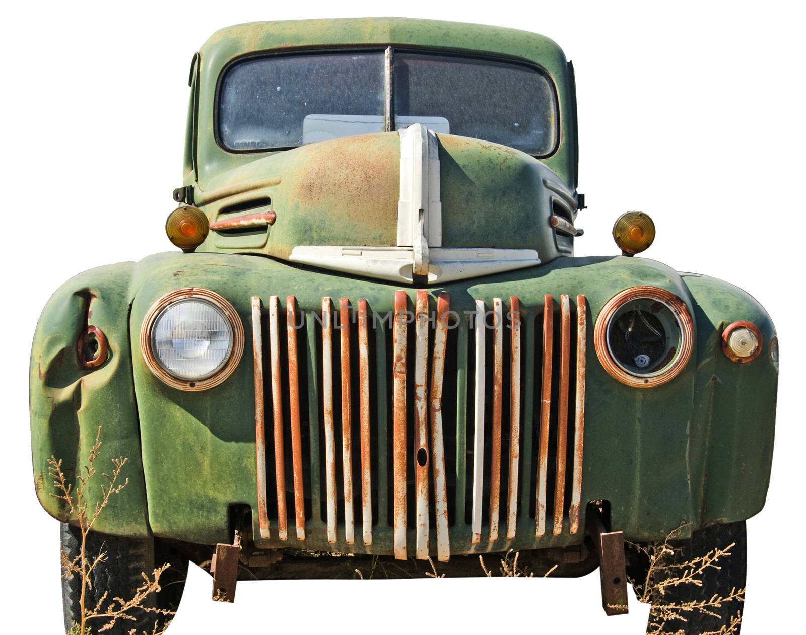 Dented up pick up truck cut out of a junkyard. Isolated on white with a clipping path