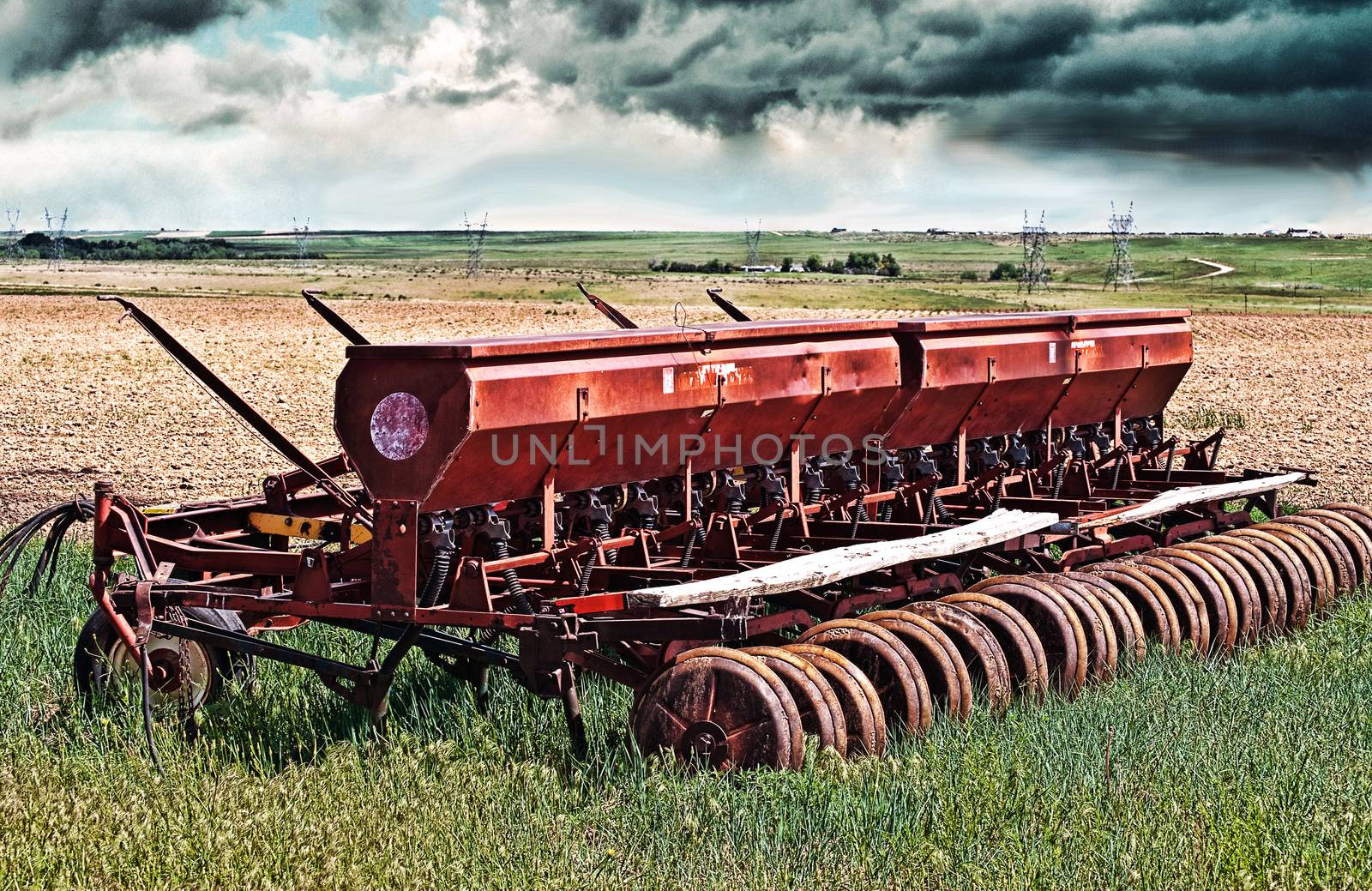 A seed drill sets while waiting for the newly planted seed to sprout.