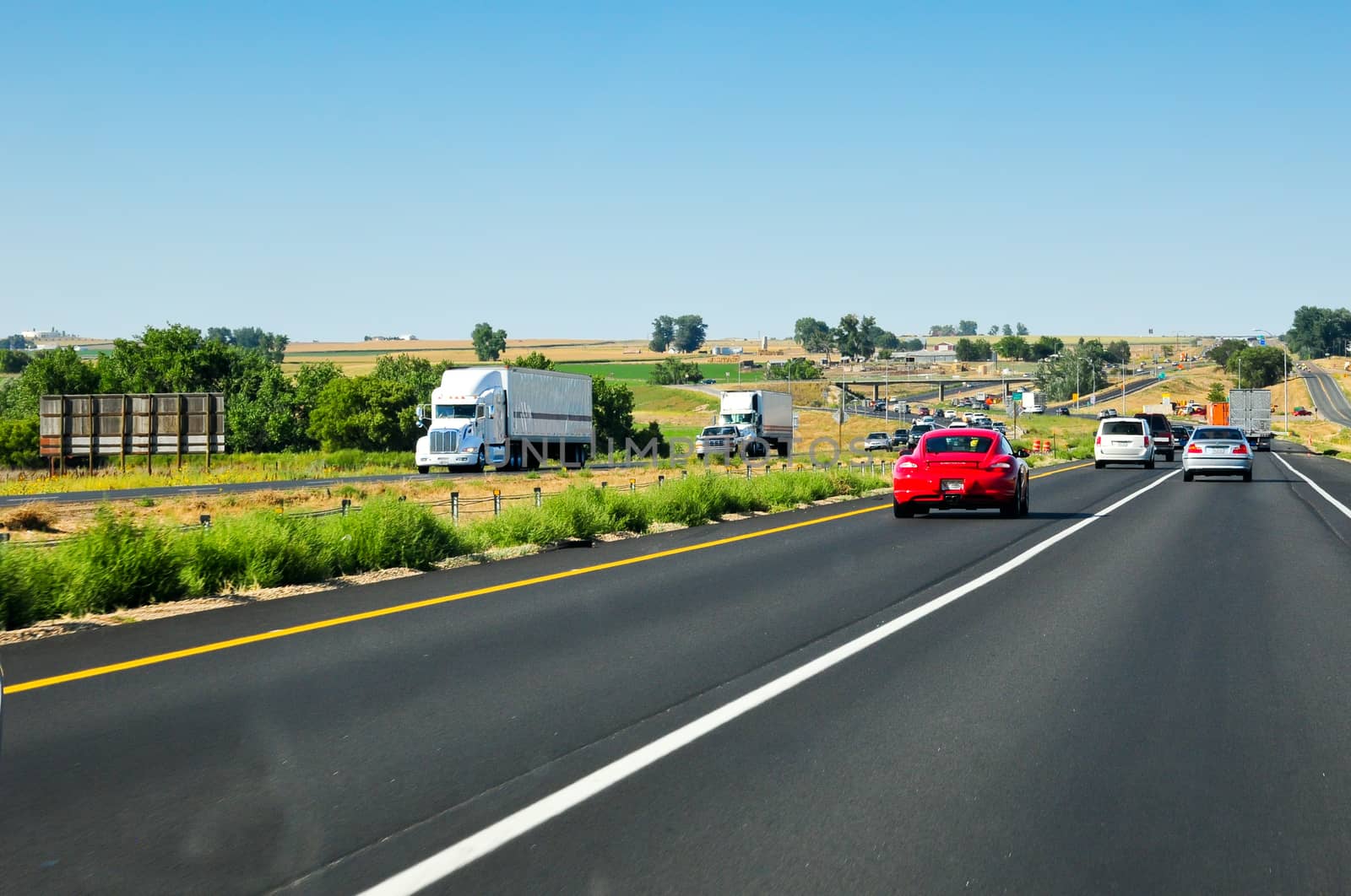 I-25 winding north towards Wyoming from Colorado on a bright summer day