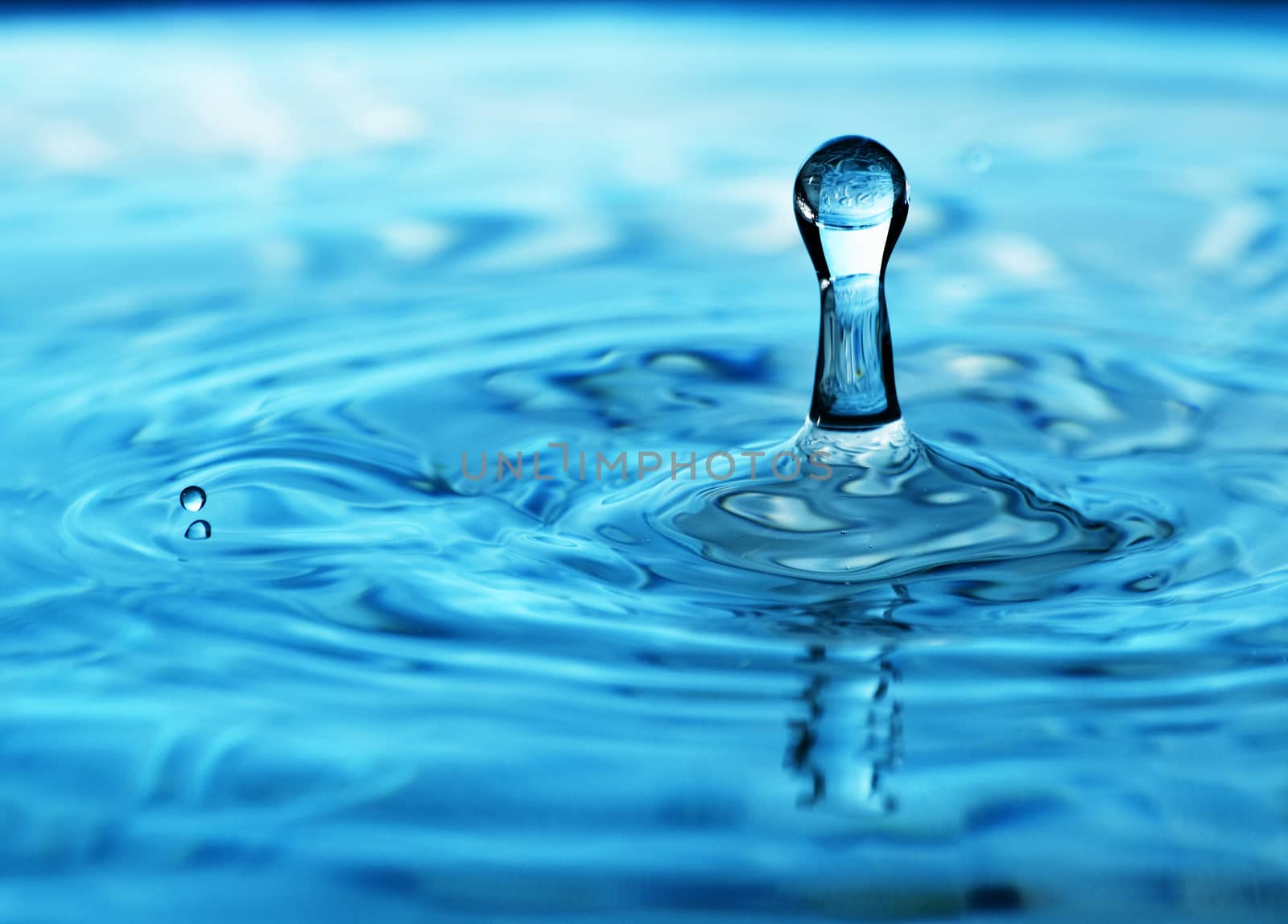 Stop action photo of a deep blue water drop