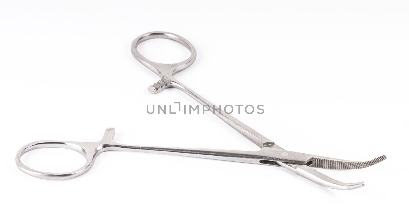surgical clamps on a white background