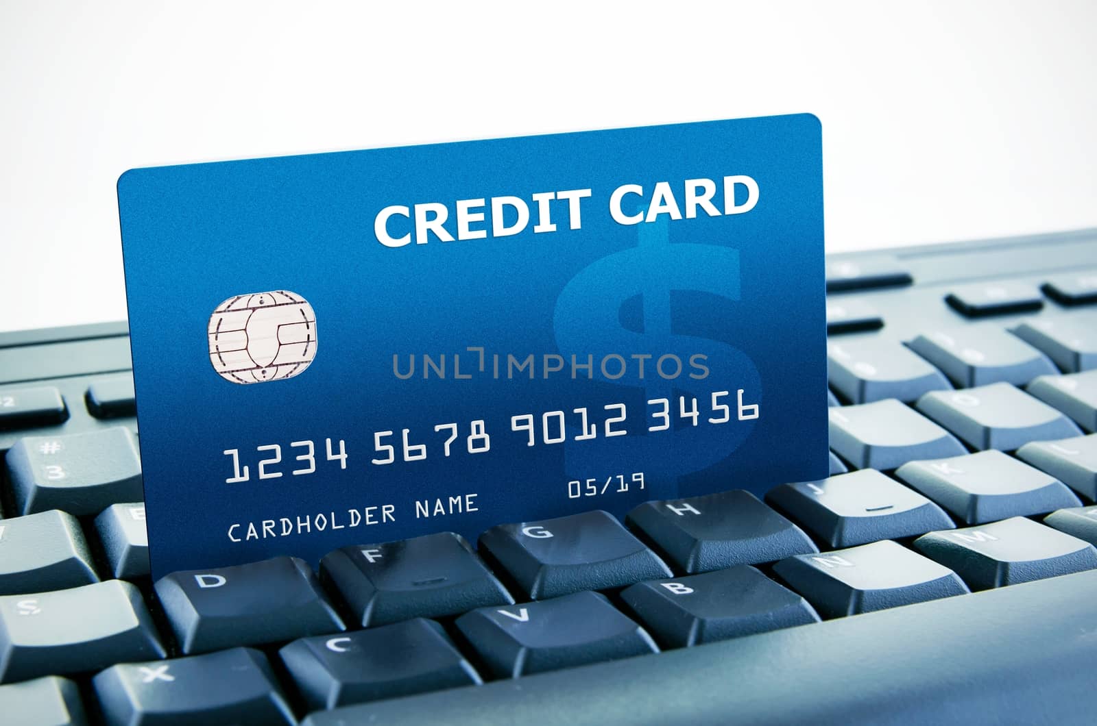 Personal credit card on computer keyboard