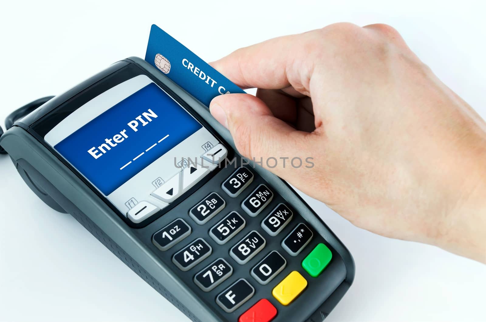 Hand with credit card swipe through terminal for sale. Enter PIN on display