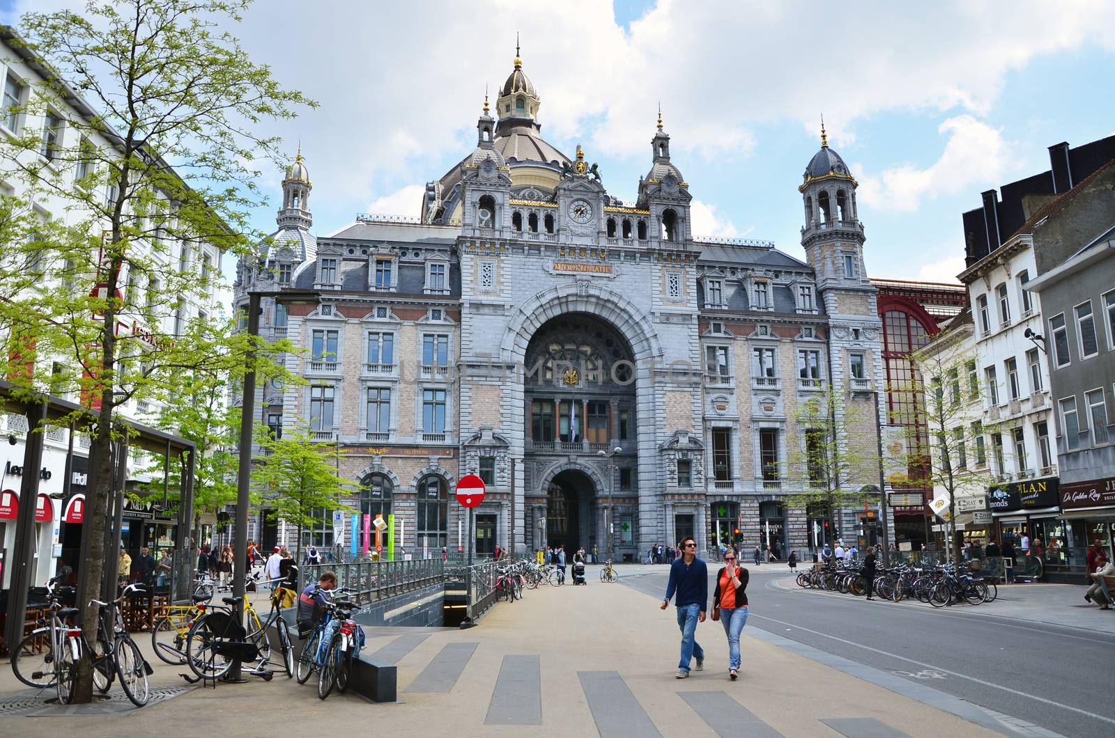 Antwerp, Belgium - May 11, 2015: People around Antwerp main railway station on  May 11, 2015 in Antwerp, Belgium. The original station building was constructed between 1895 and 1905.