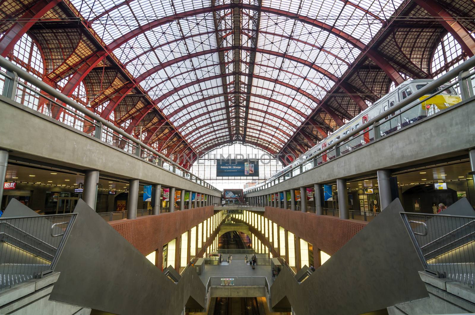 Antwerp, Belgium - May 11, 2015: People in Main hall of Antwerp Central station on May 11, 2015 in Antwerp, Belgium. The station is now widely regarded as the finest example of railway architecture in Belgium.