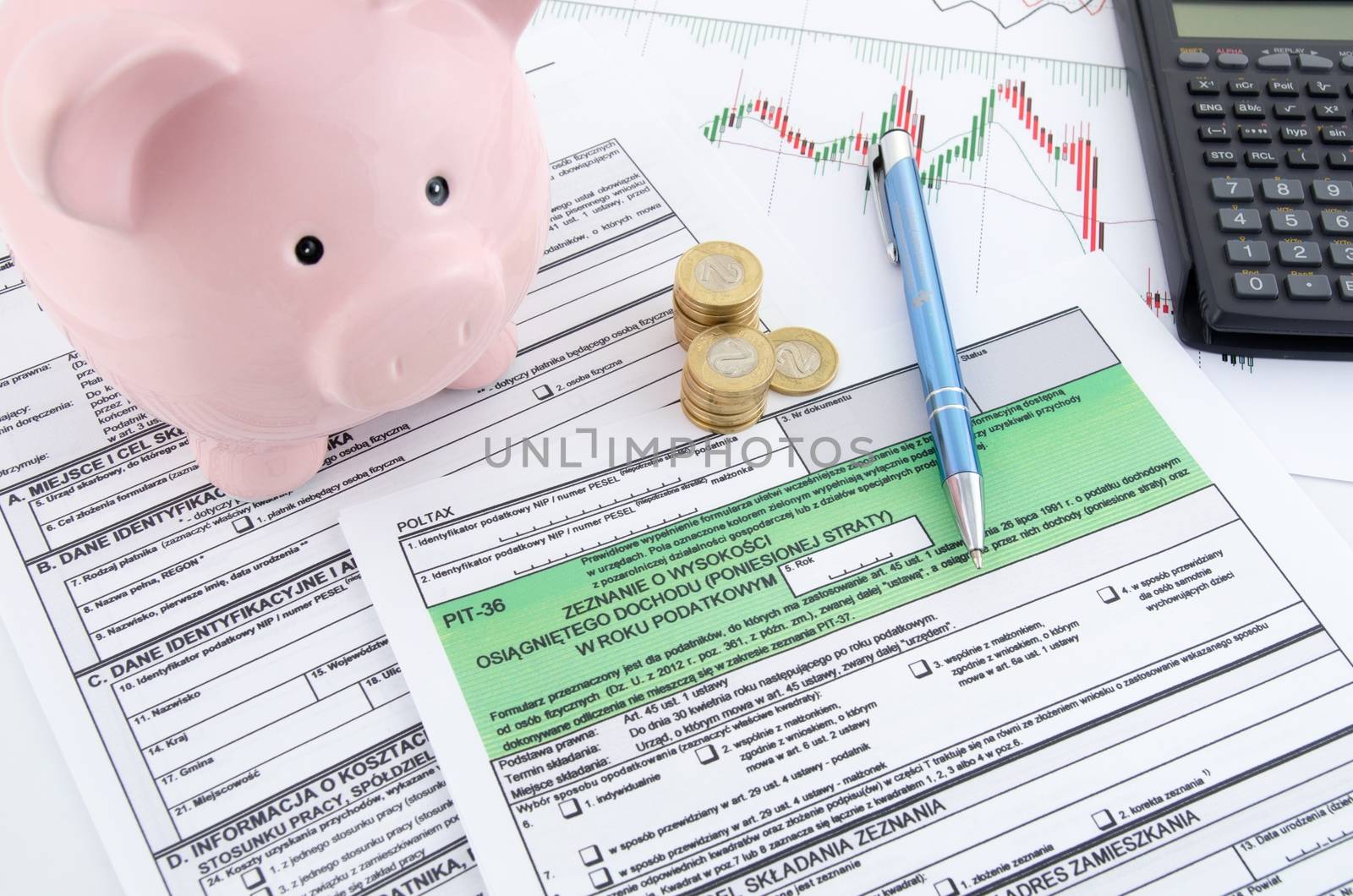 Polish income tax forms with calculator and piggybank