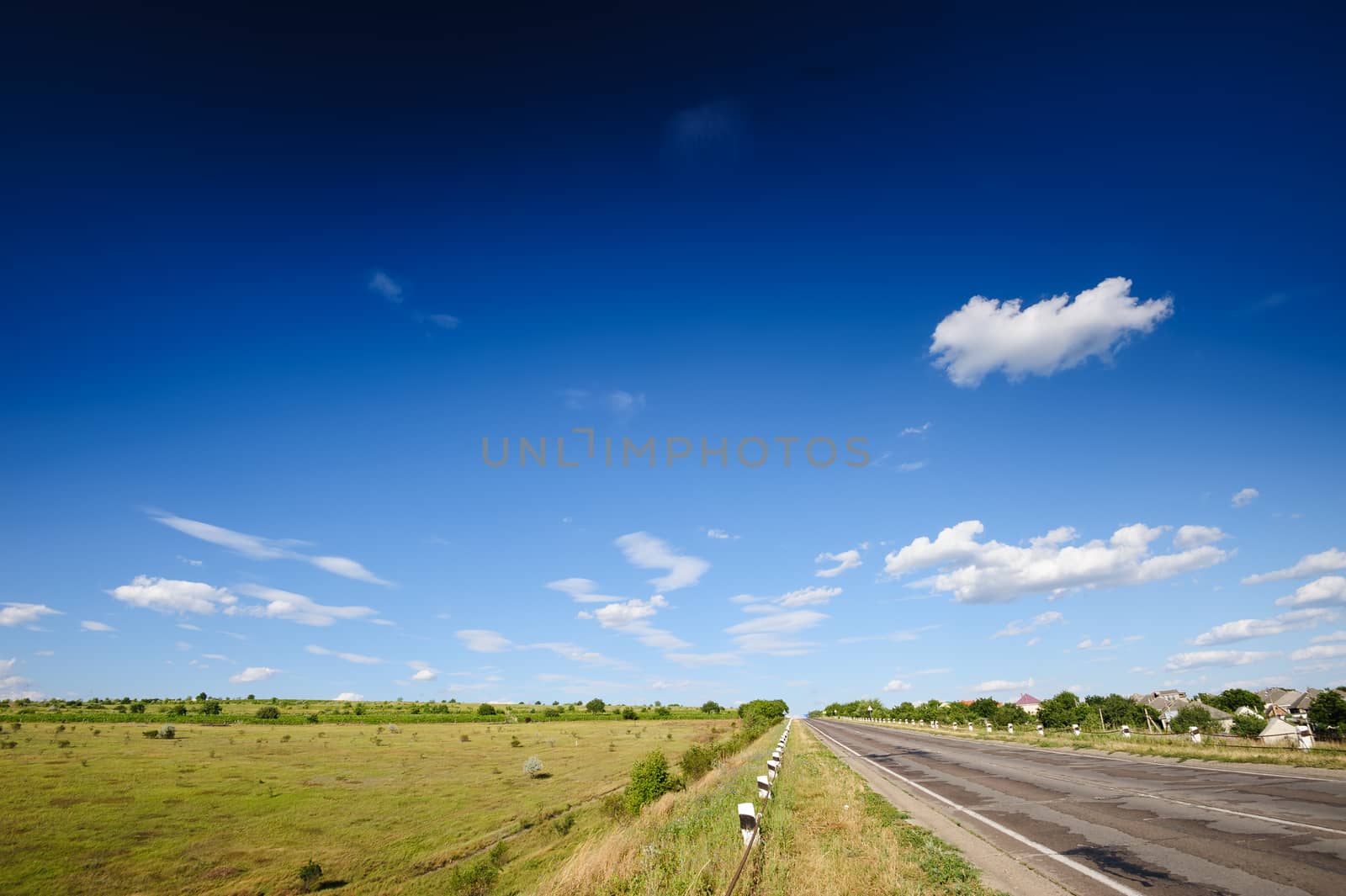 Road and agricultural fields, typical landscape in Republic of Moldova