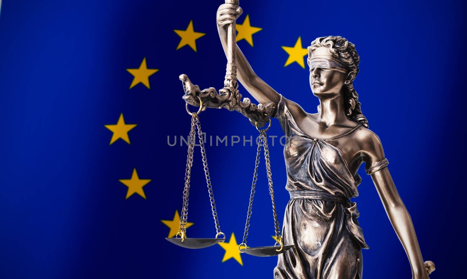 Themis with scale, symbol of justice on European Union flag background composition