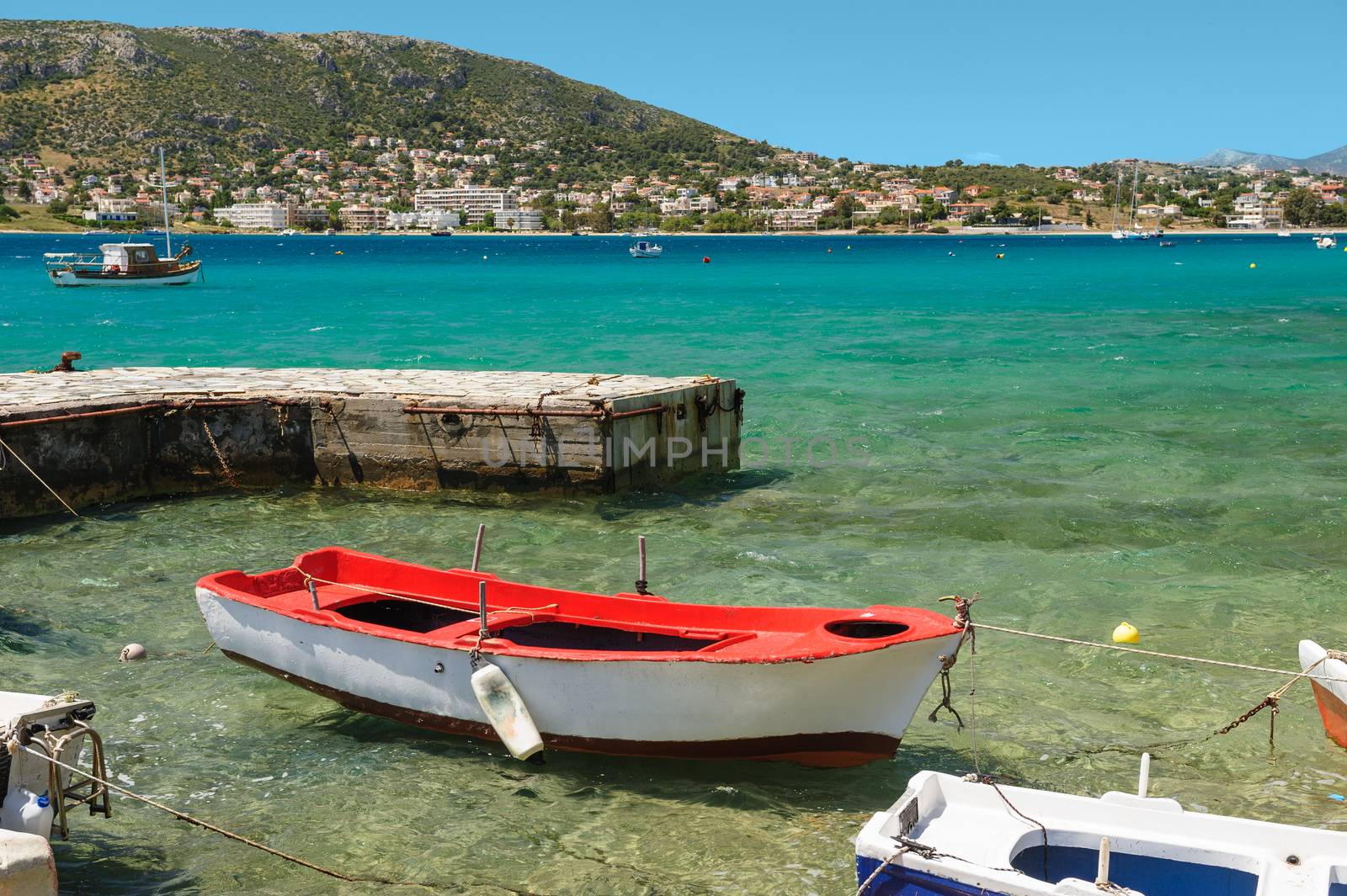 Porto Rafti harbor view with fisher boats during summertime, Greece