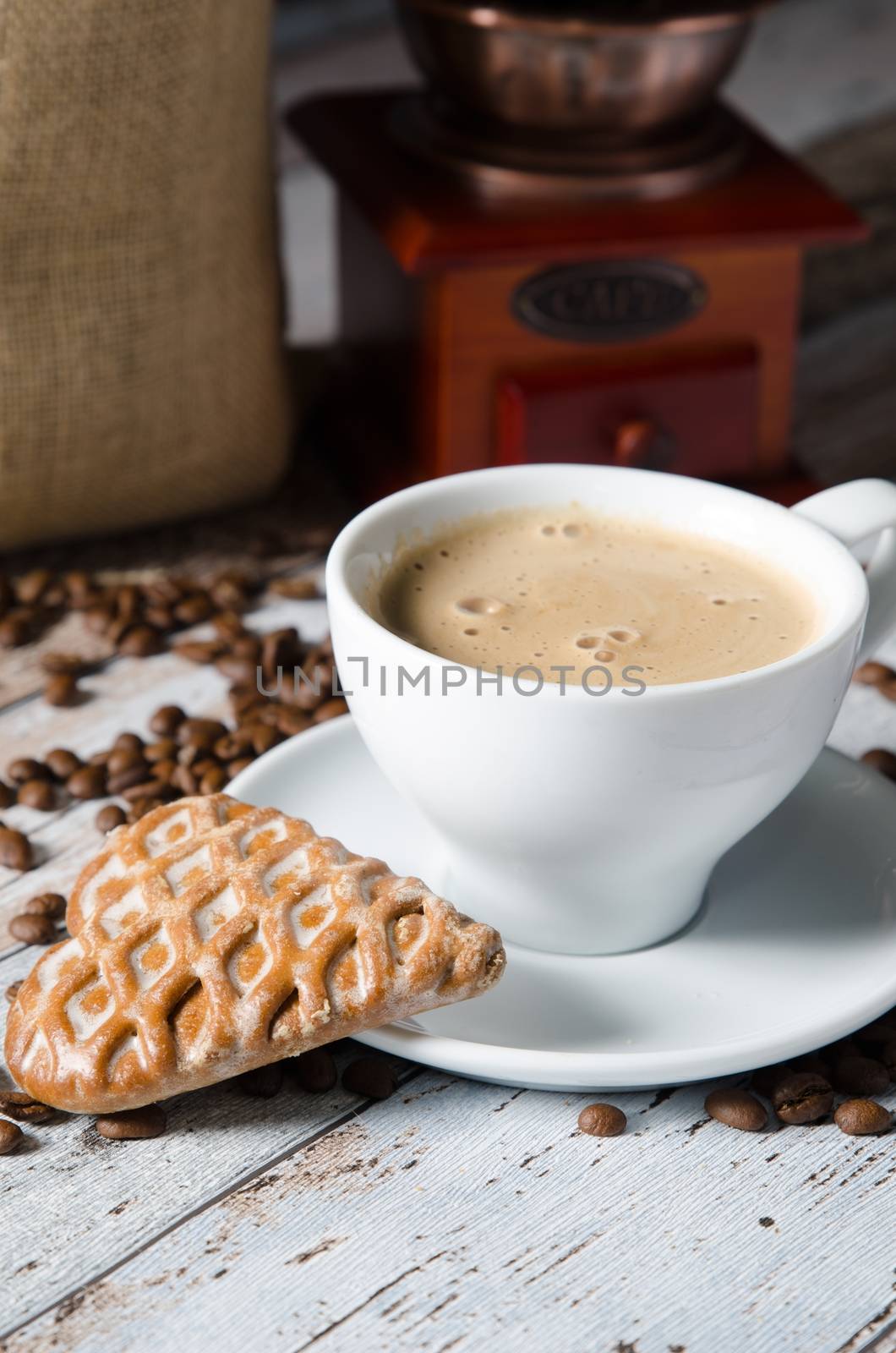 Coffee, gingerbread and old retro mill grinder. Roasted beans 