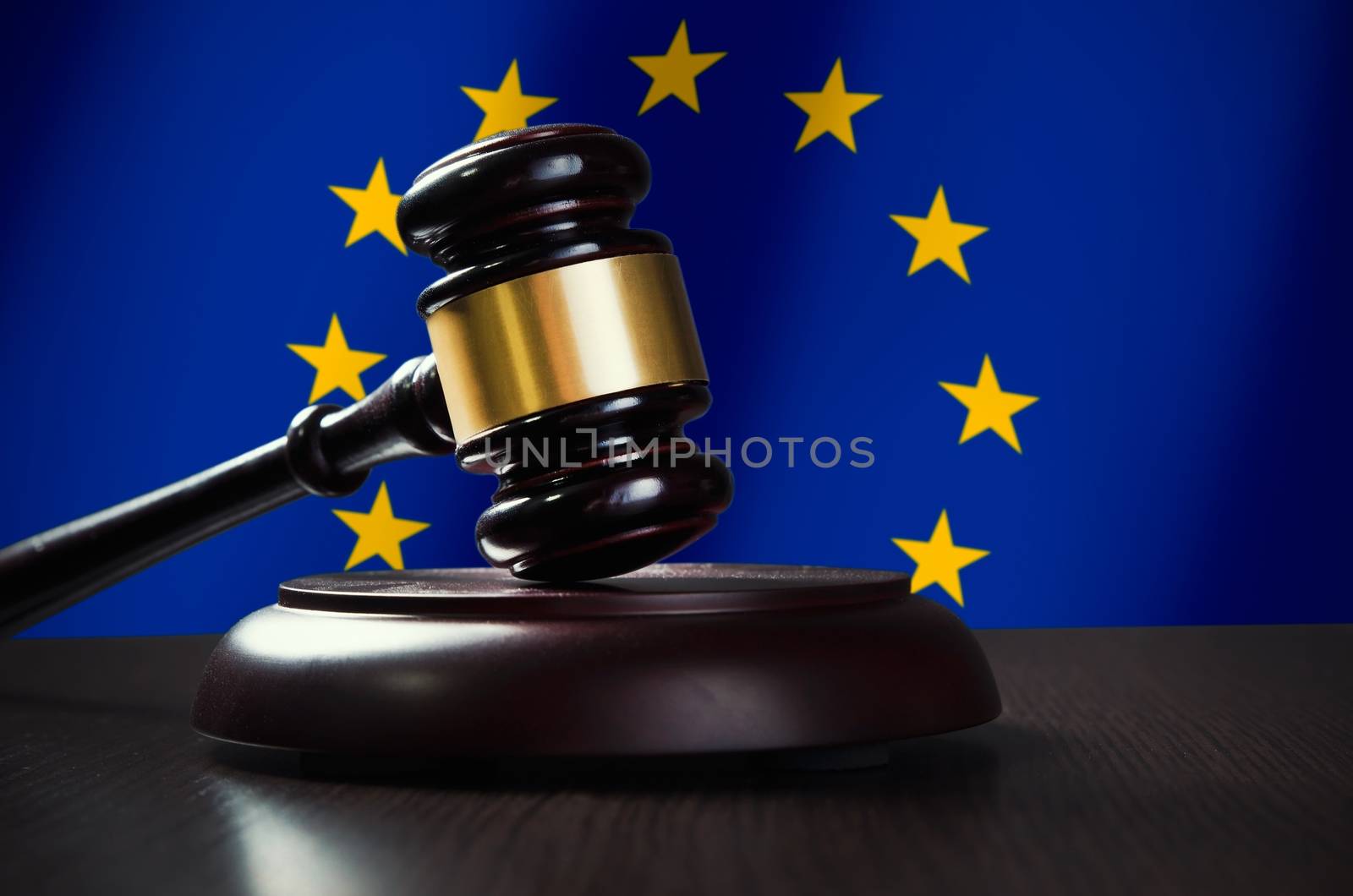 Wooden gavel with European Union flag in background. Justice and law symbol