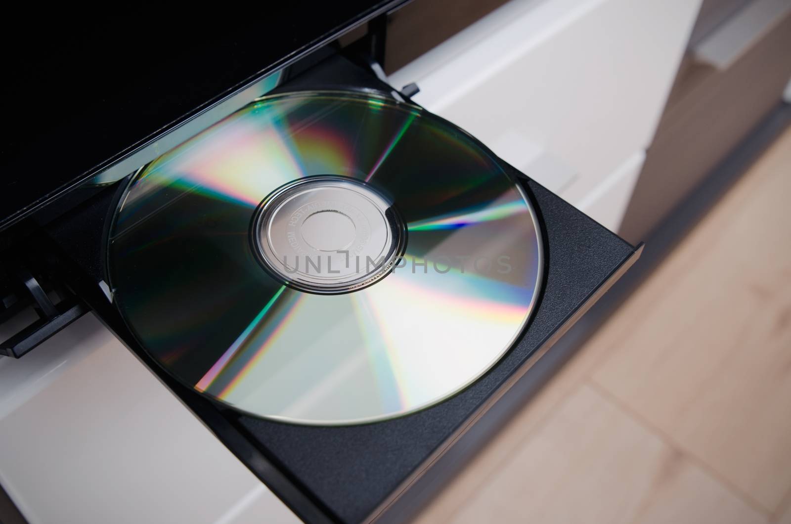 Close up of Blu-ray or DVD player with inserted disc