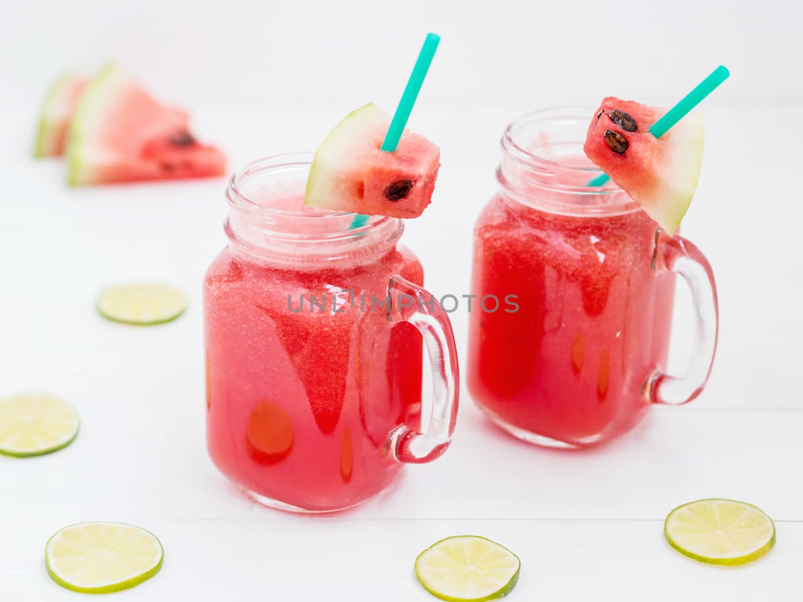 Watermelon smothie and slices on white background by fascinadora