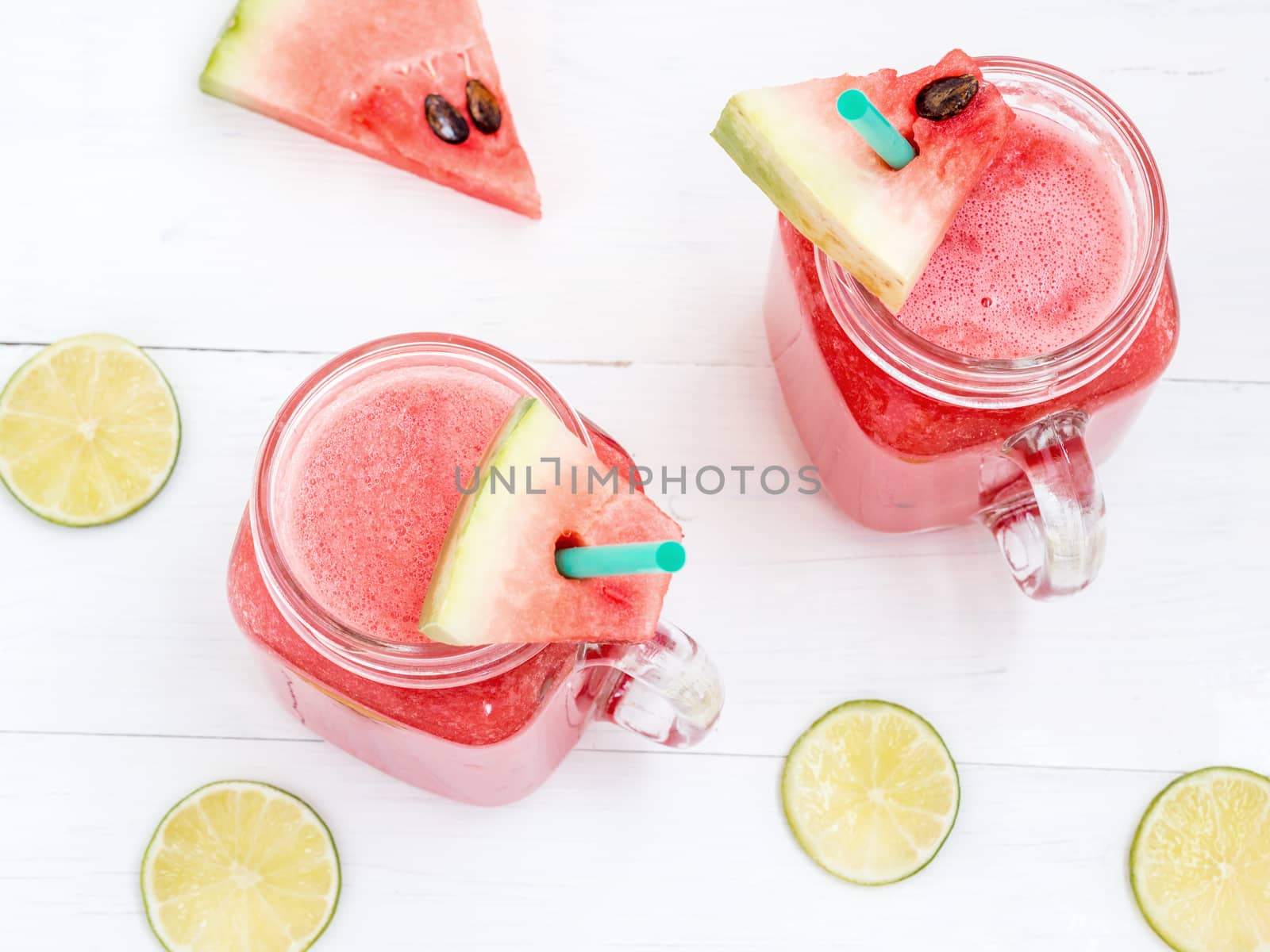 Watermelon smothie and slices on white background by fascinadora