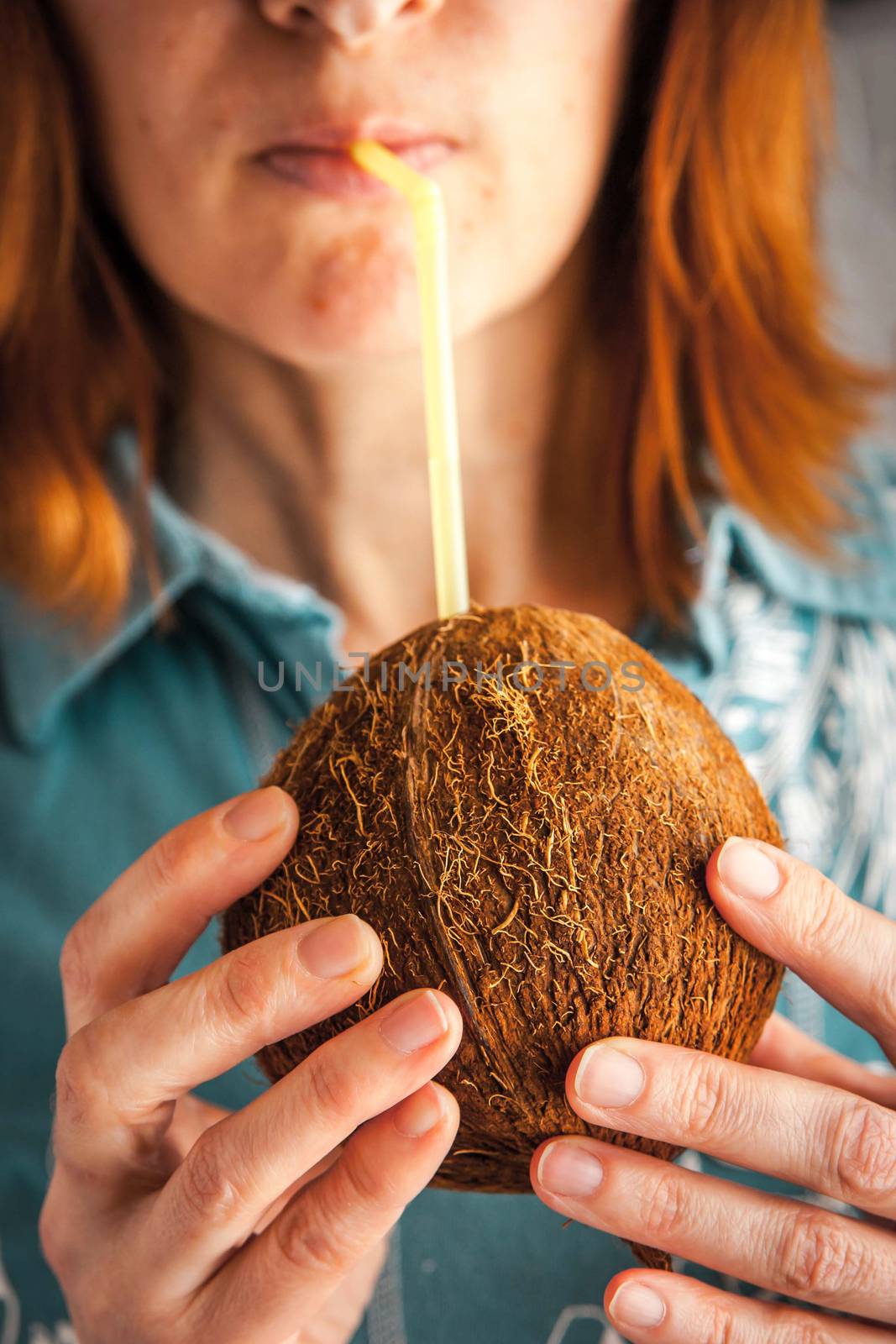 Woman drinking coconut milk