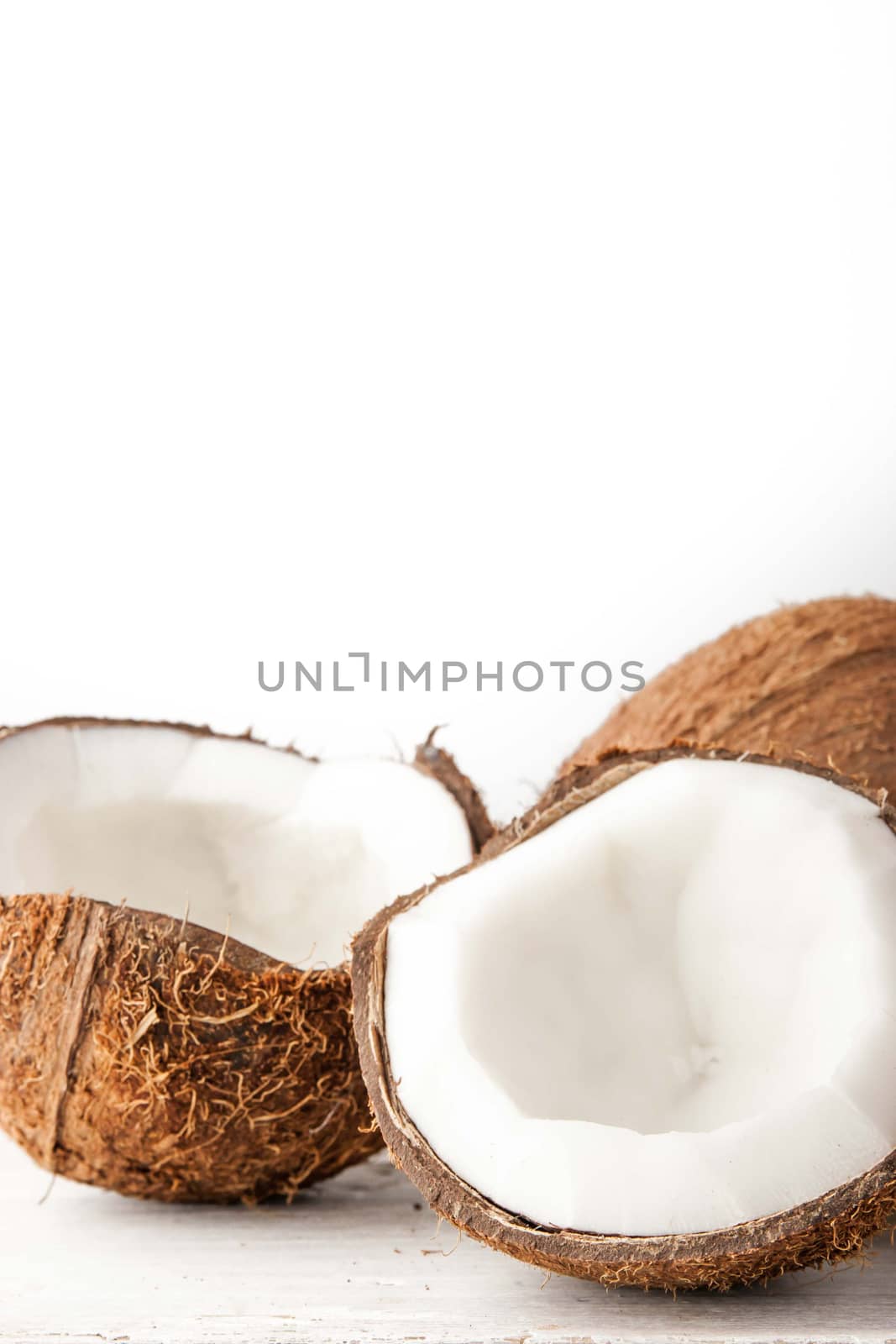 Coconuts  on the white background vertical