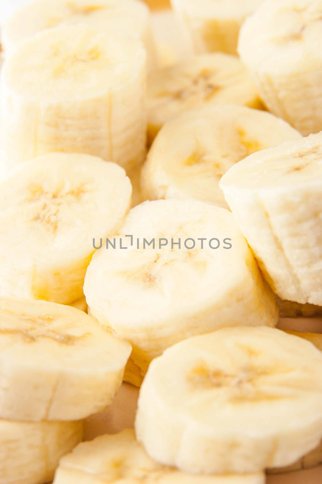 Banana slices background vertical