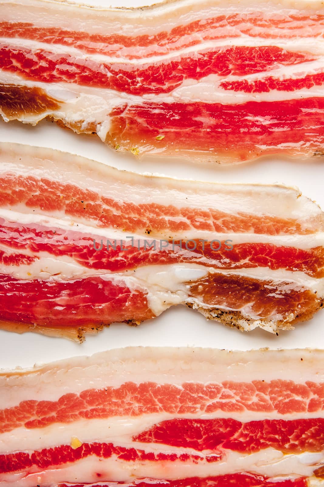 Streaky bacon on the white  background vertical
