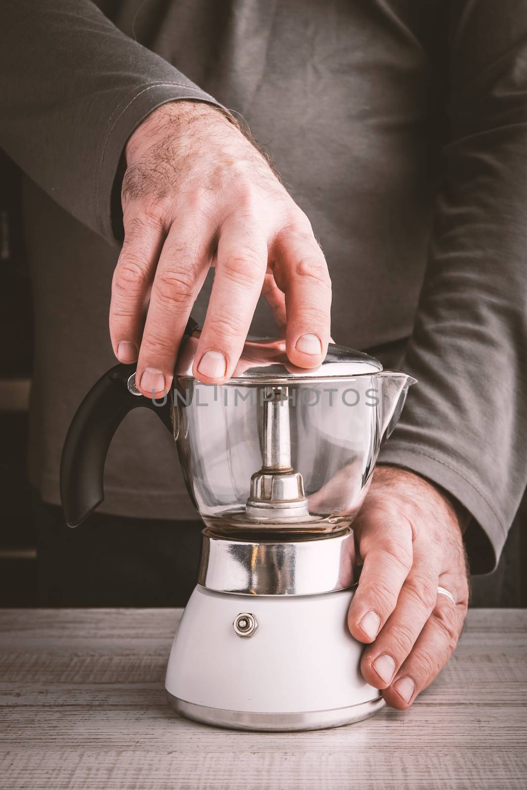 Hands with coffee maker