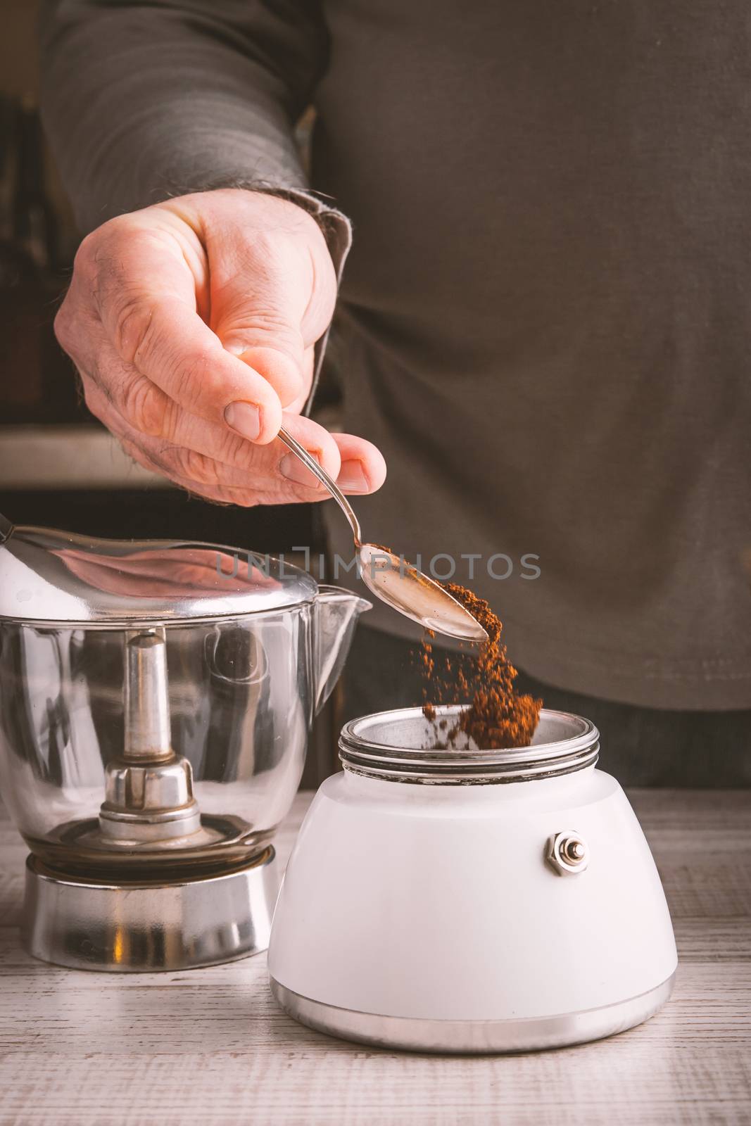 Man making coffee vertical by Deniskarpenkov