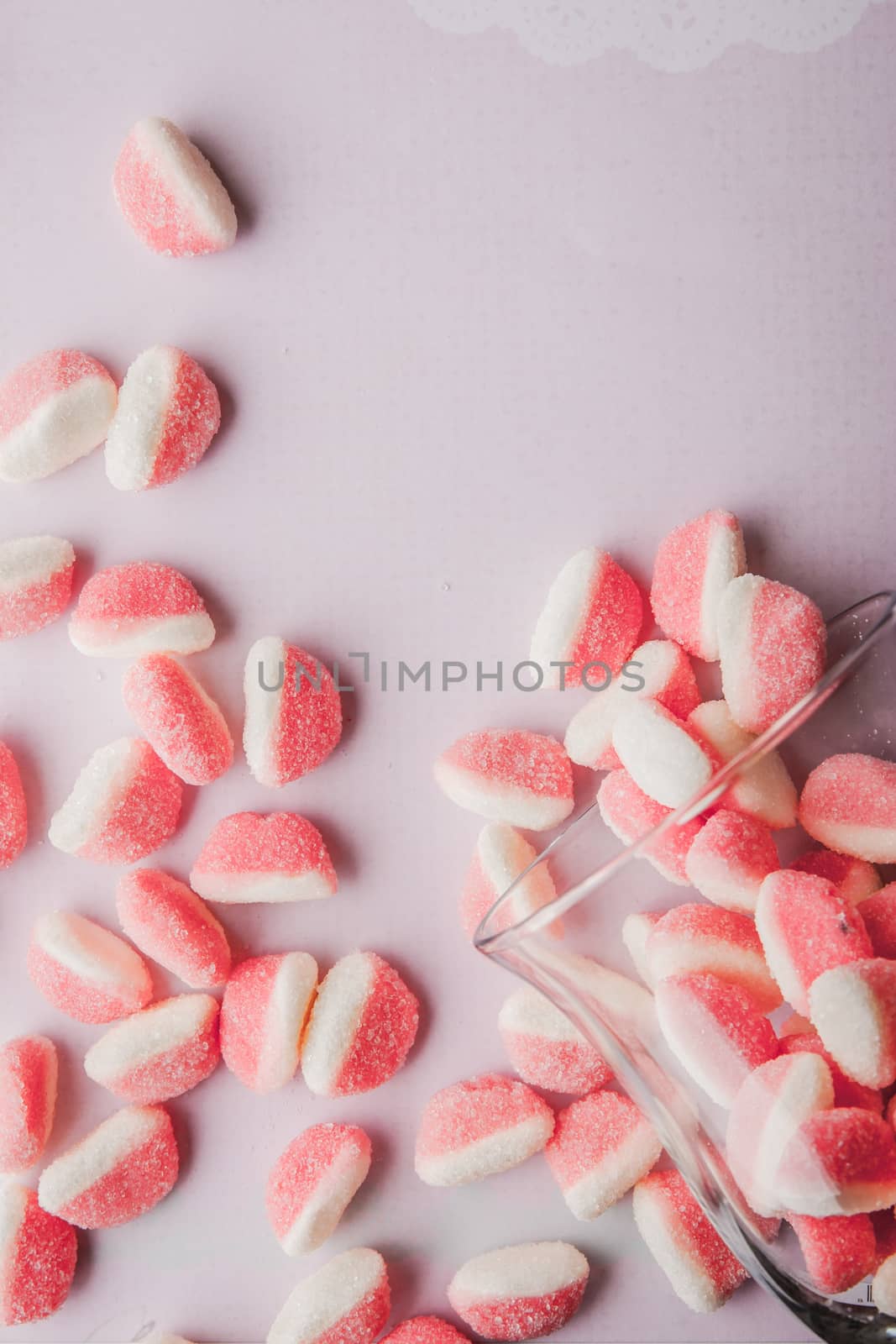 Fruit jellies  on the pink background vertical
