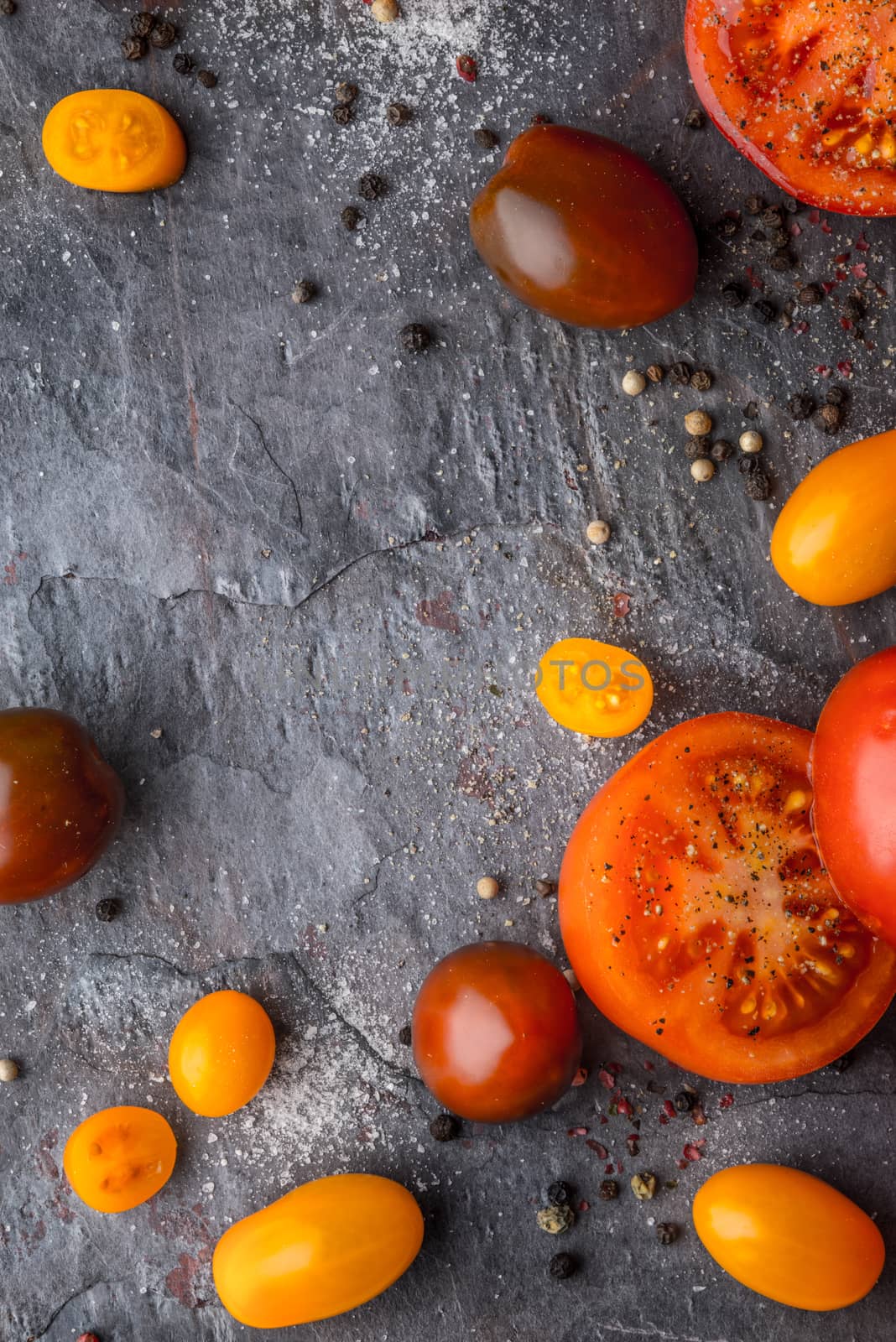 Tomatoes mix  with seasoning on the stone table by Deniskarpenkov