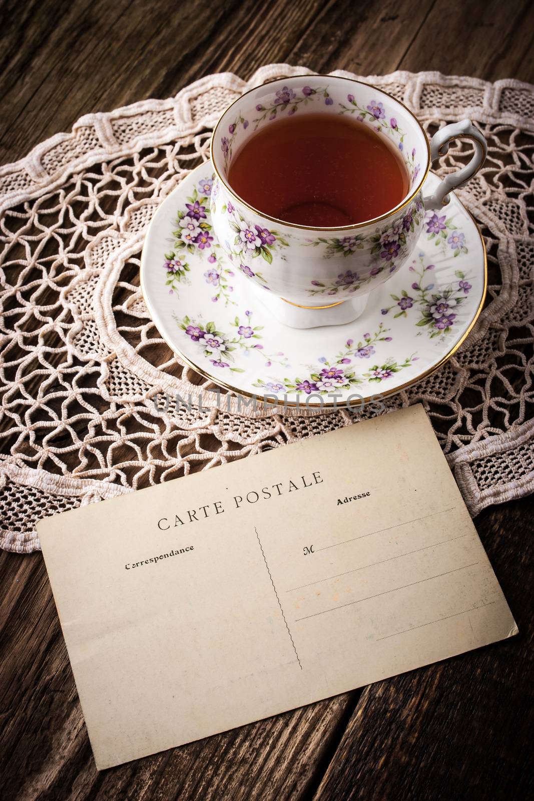 Cup of tea with postcard vertical by Deniskarpenkov