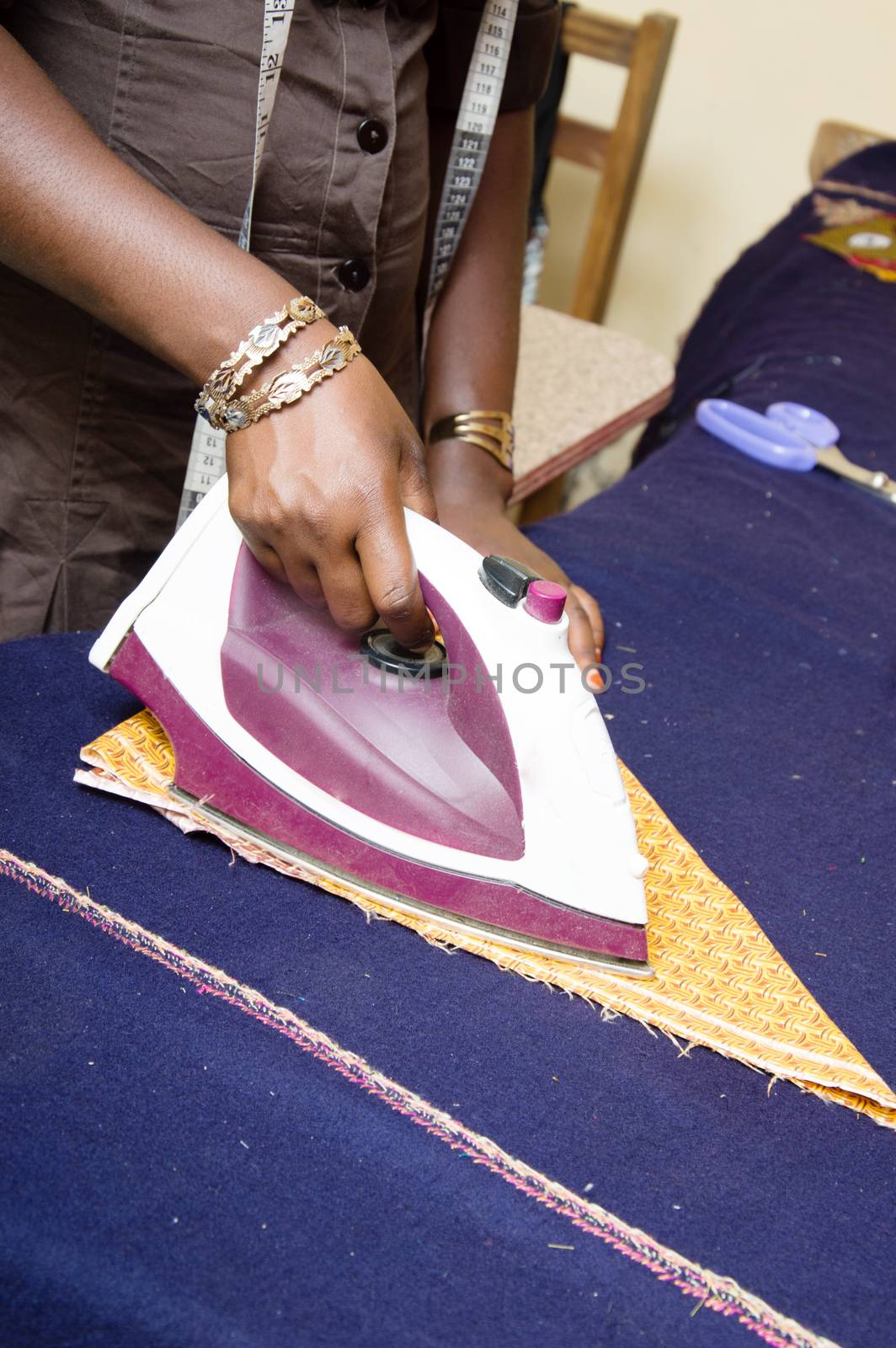 The designers still use the iron to prepare their pieces of fabric.