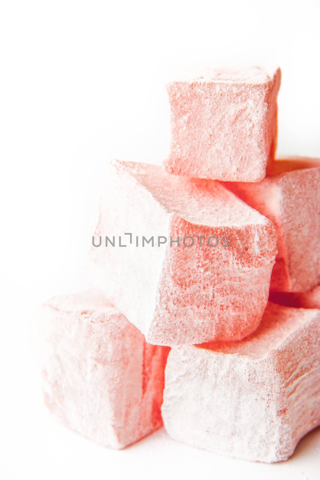 Pink Turkish delight on the white background vertical