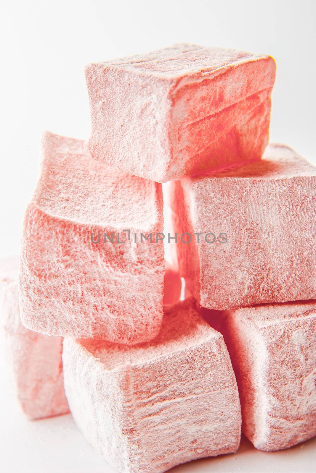 Pink Turkish delight on the white background close-up by Deniskarpenkov