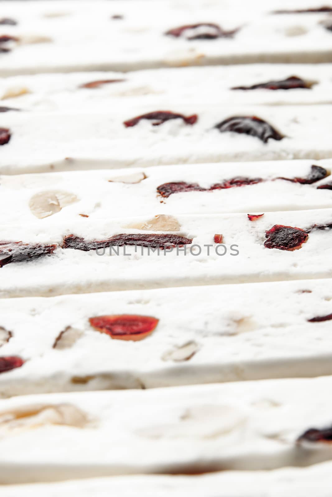 Nougat with fruit and nuts background vertical by Deniskarpenkov