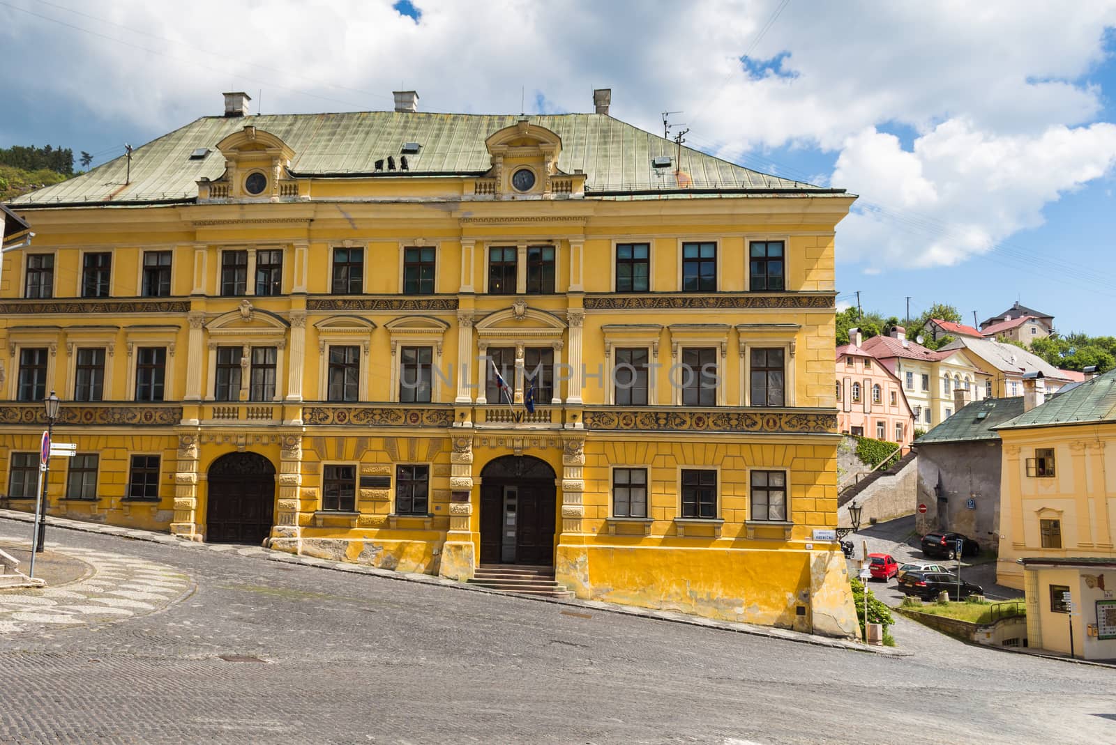 Yellow building on the square in Banska Stiavnica, Slovakia by YassminPhoto