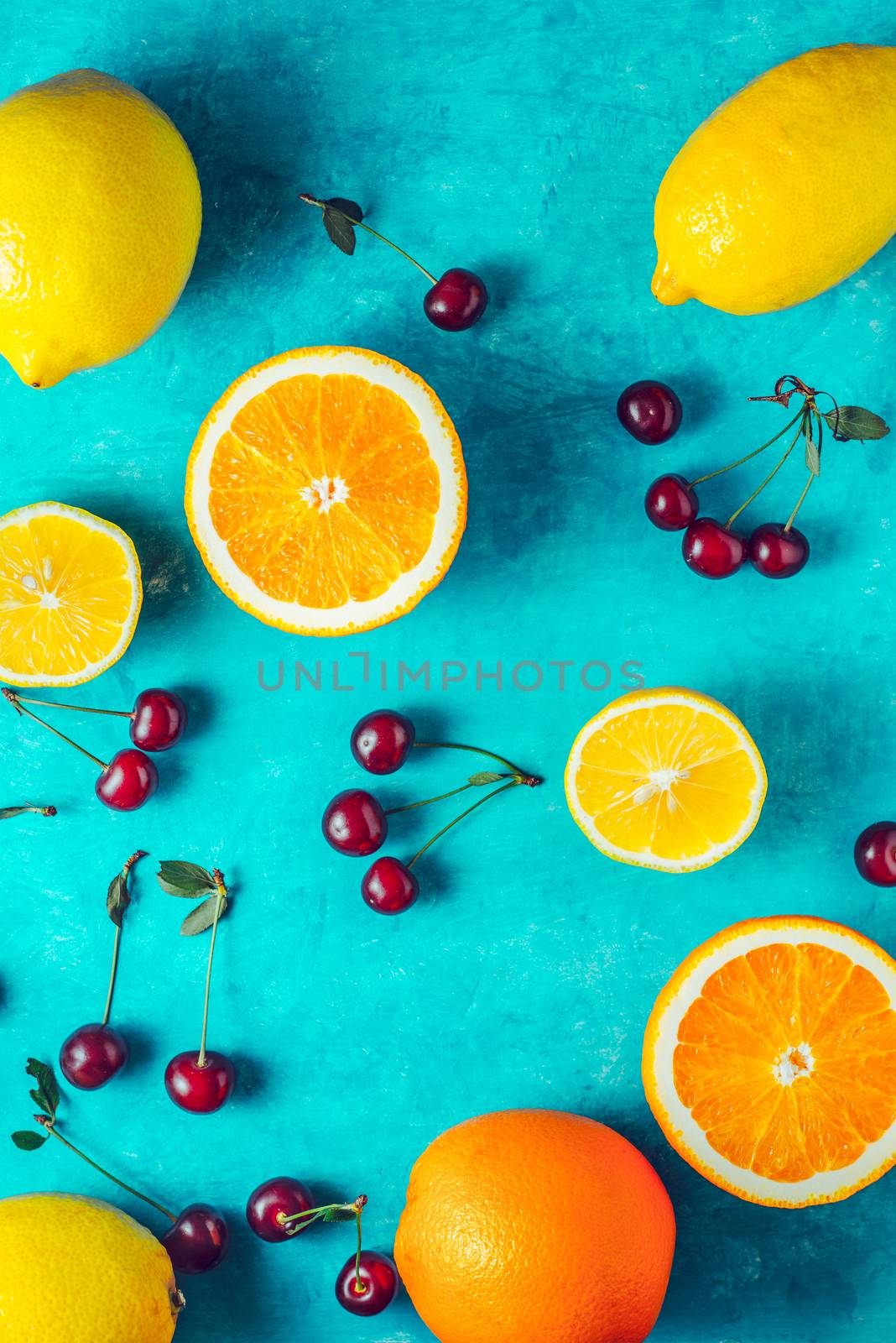 Fruit mix on the cyan background vertical