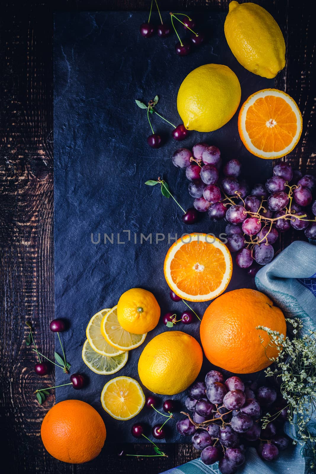 Different fruit on the dark background vertical by Deniskarpenkov