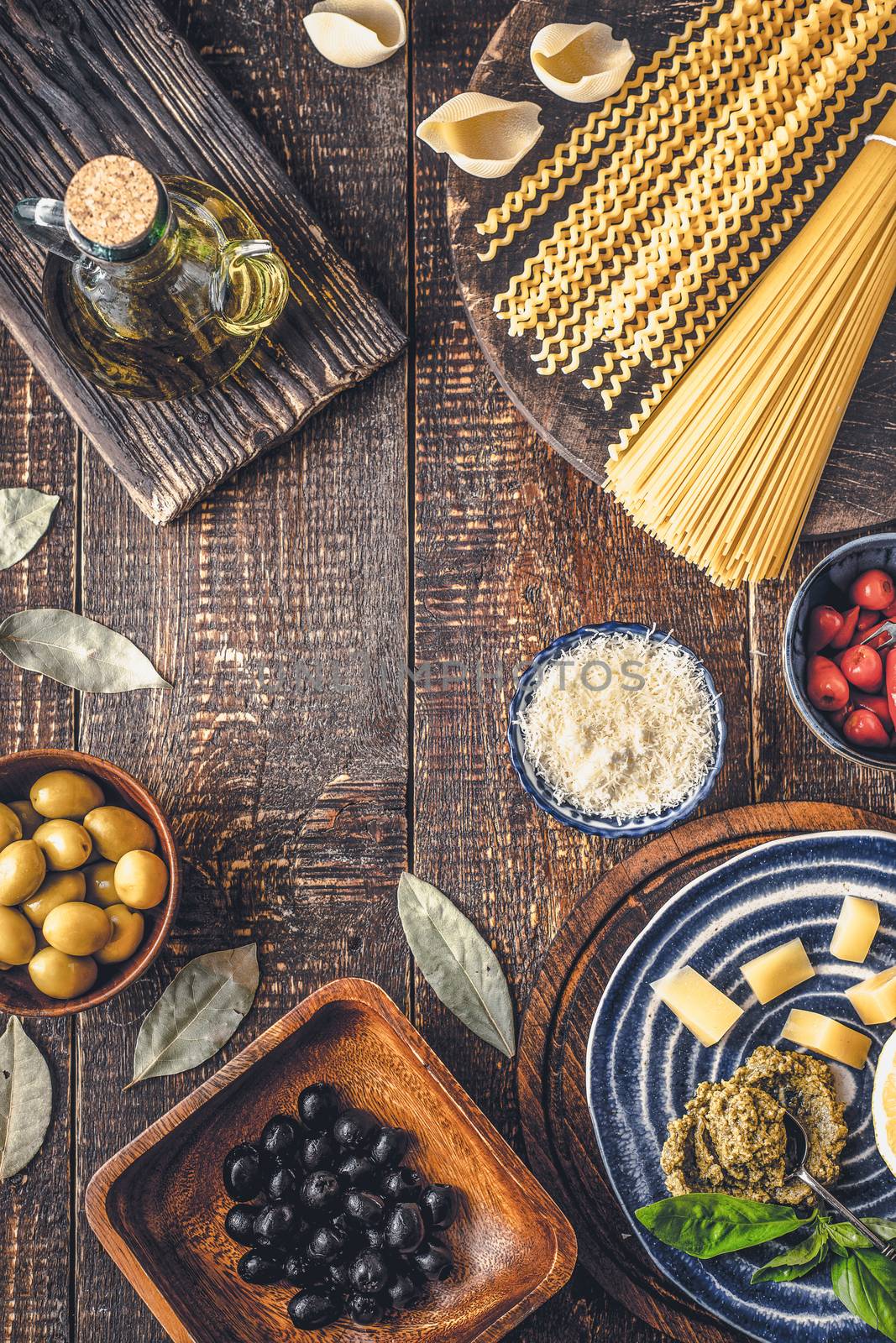 Ingredients of Italian cuisine on the wooden table vertical
